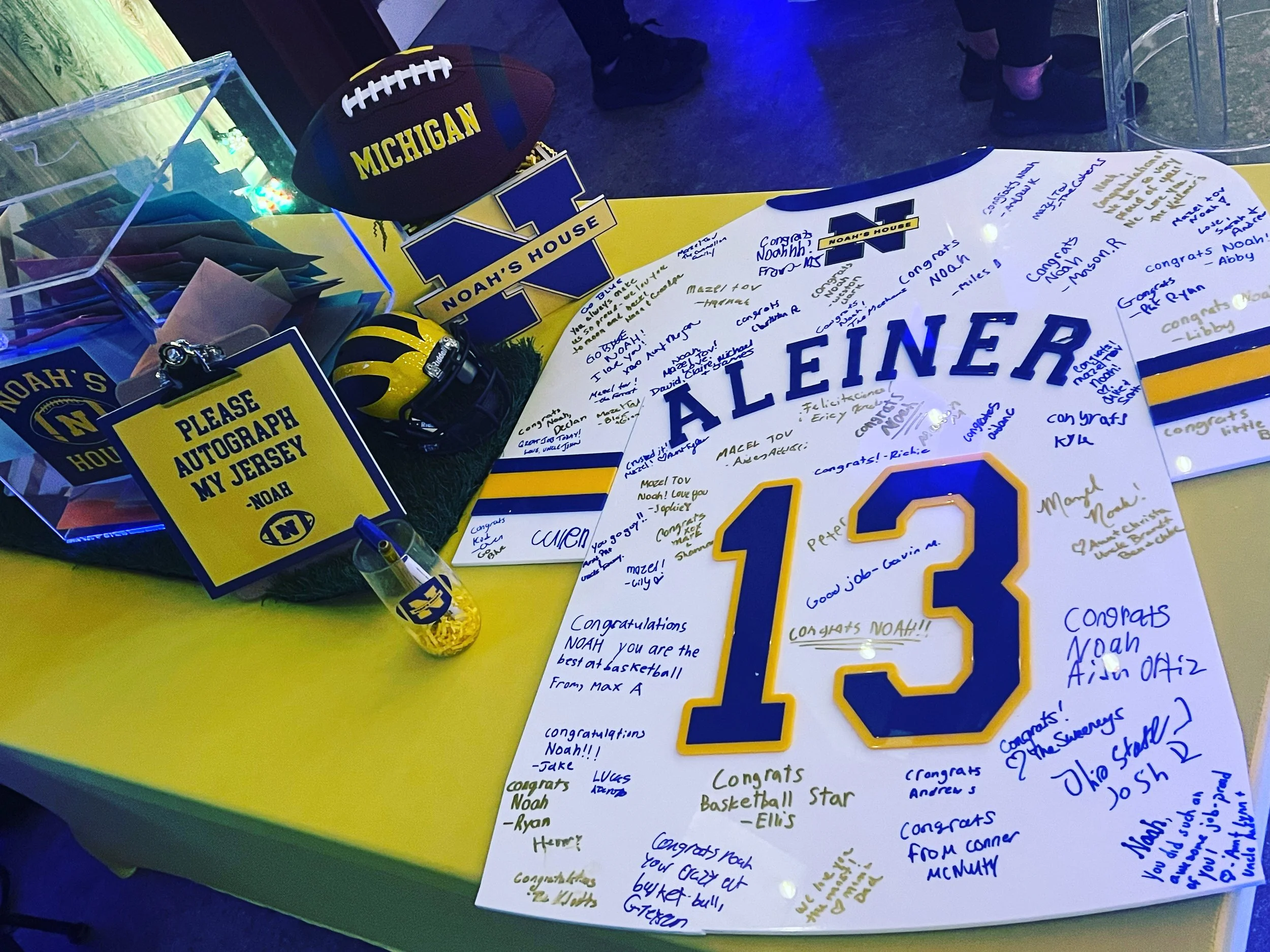 Custom blue, white, and yellow football jersey. 