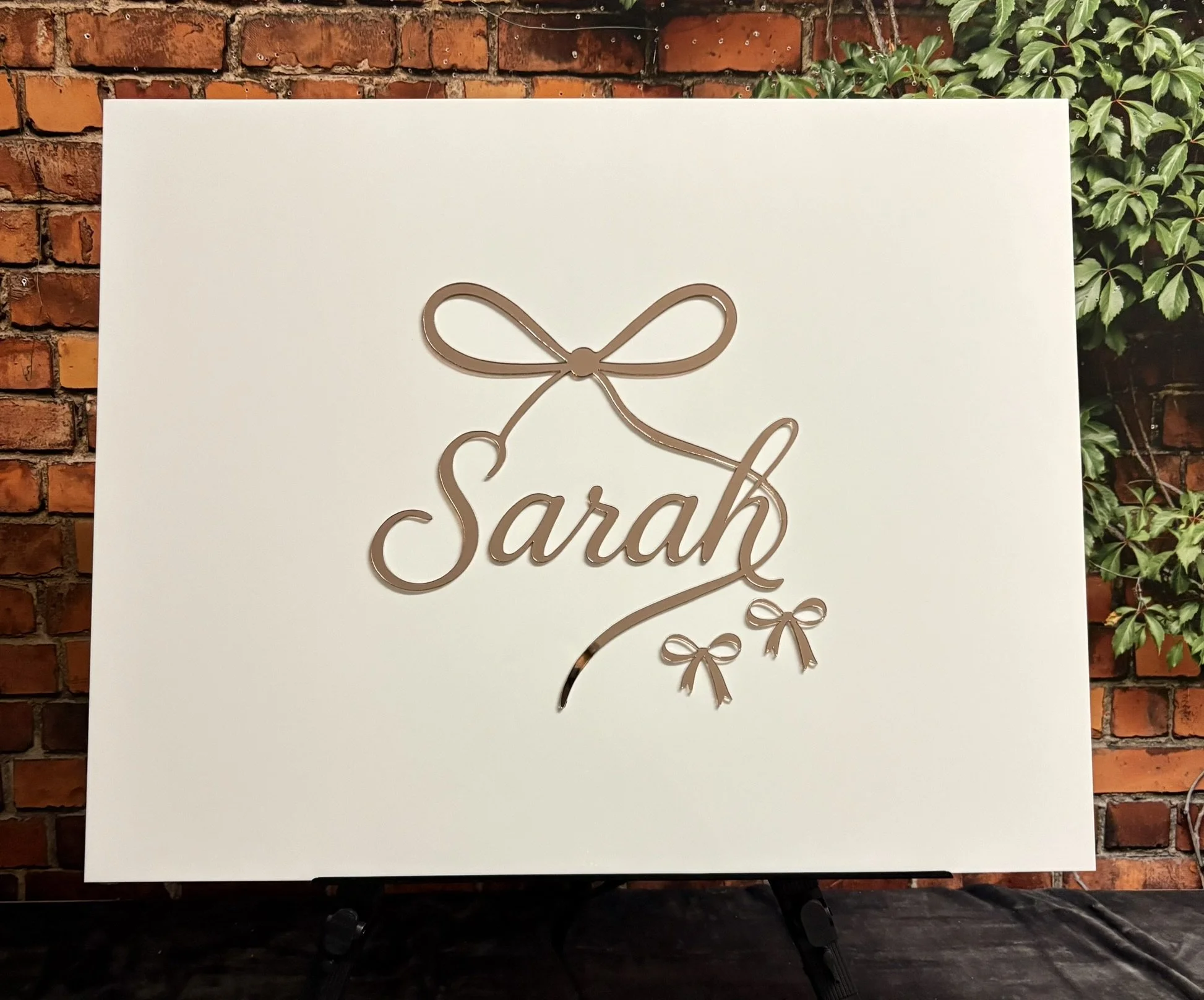 White Sign In Board_Sarah_Bow_Rose Gold_Bat.JPEG