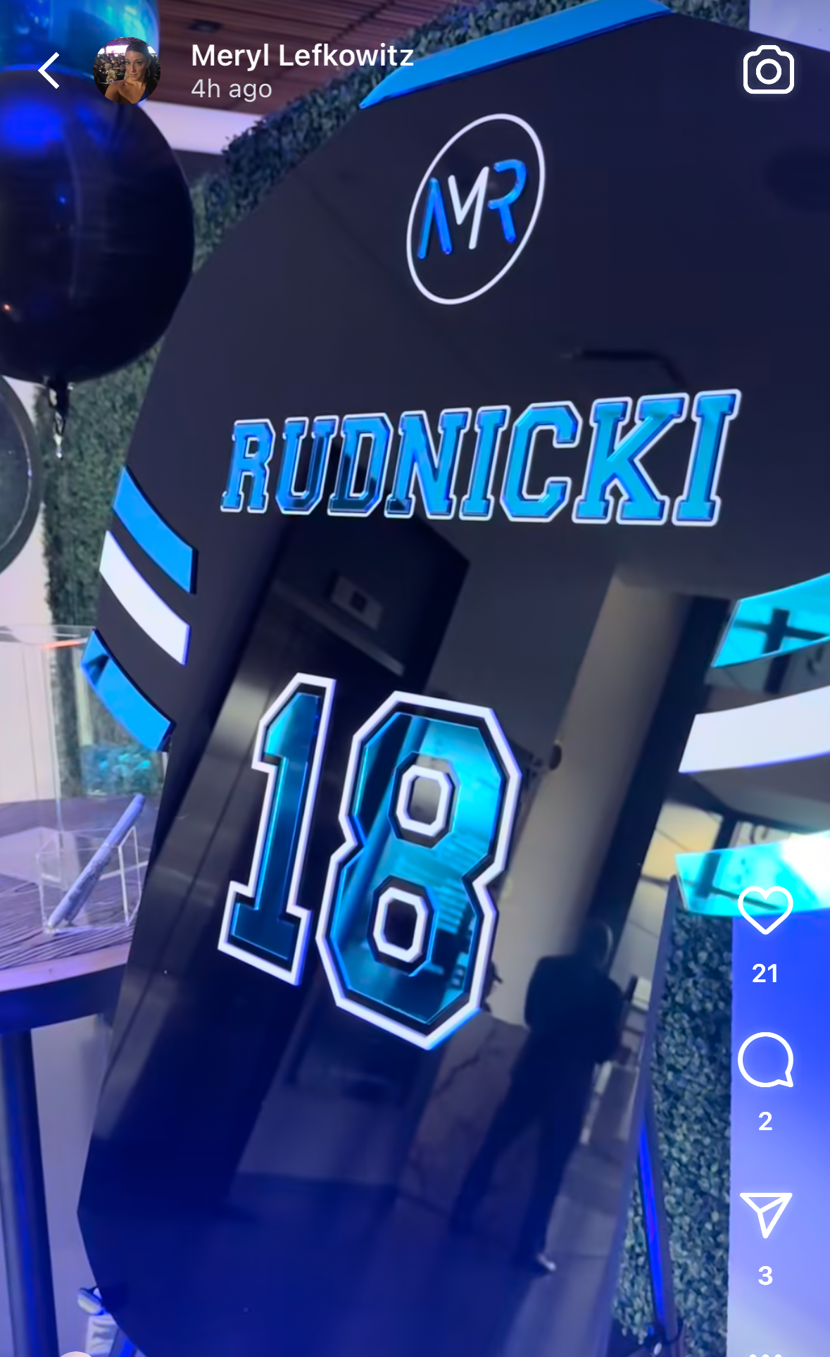 Custom black football jersey with blue mirror accents.