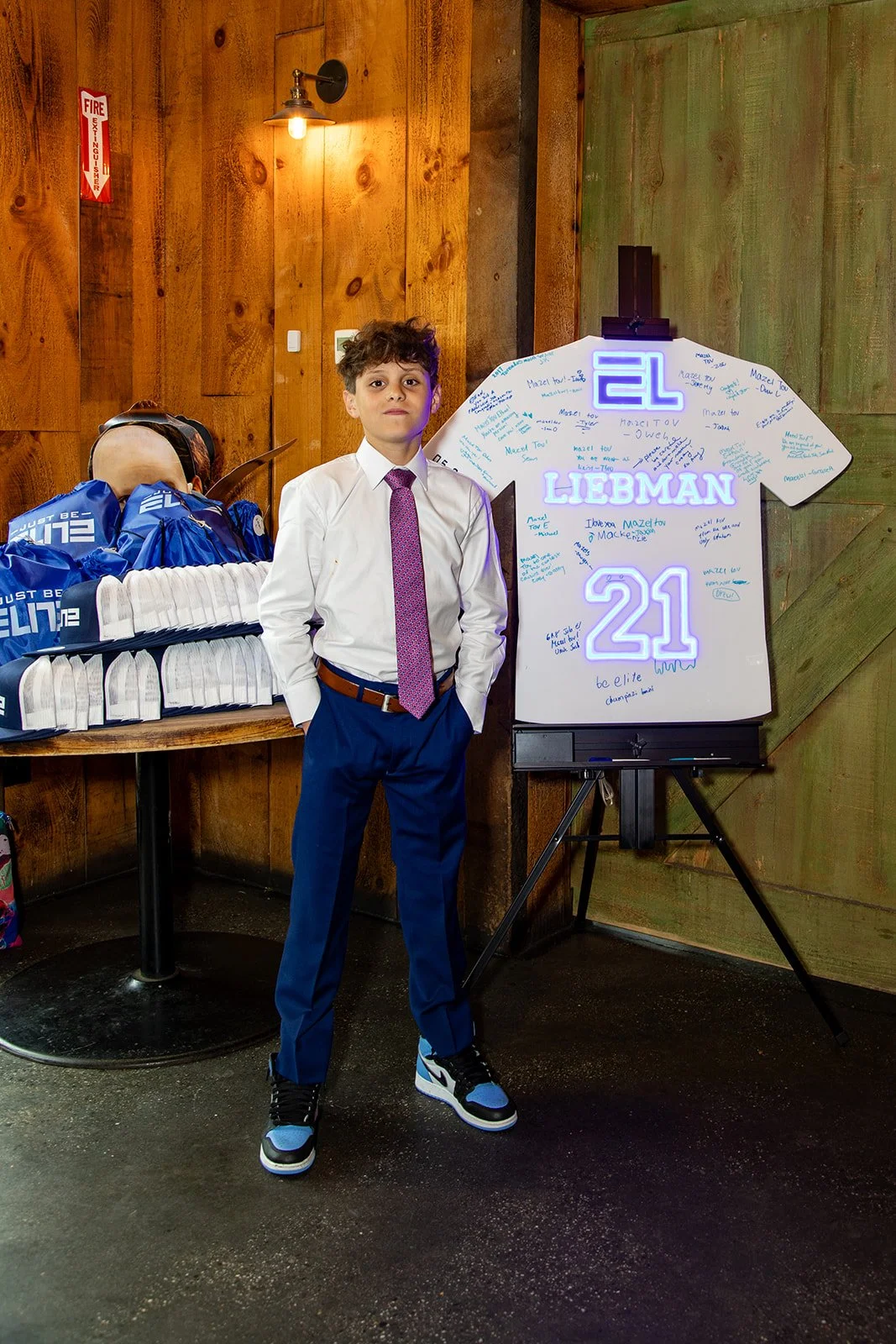 A classic baseball jersey sign-in board featuring a clean white design with bold blue neon accents. Perfect for Bar Mitzvahs, allowing guests to leave messages, signatures, and well wishes to create a memorable keepsake.