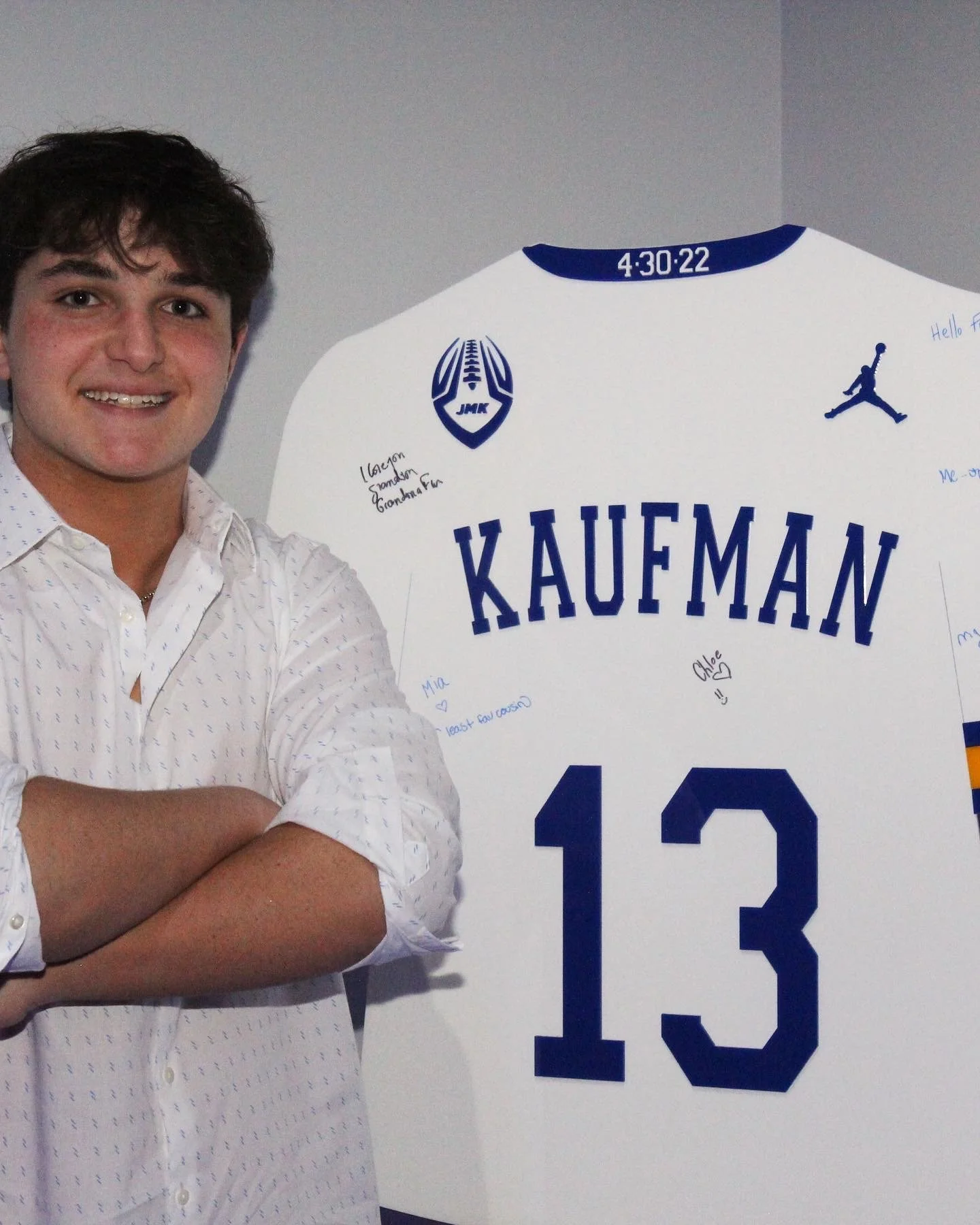 Custom blue and white football jersey sign-in board. 