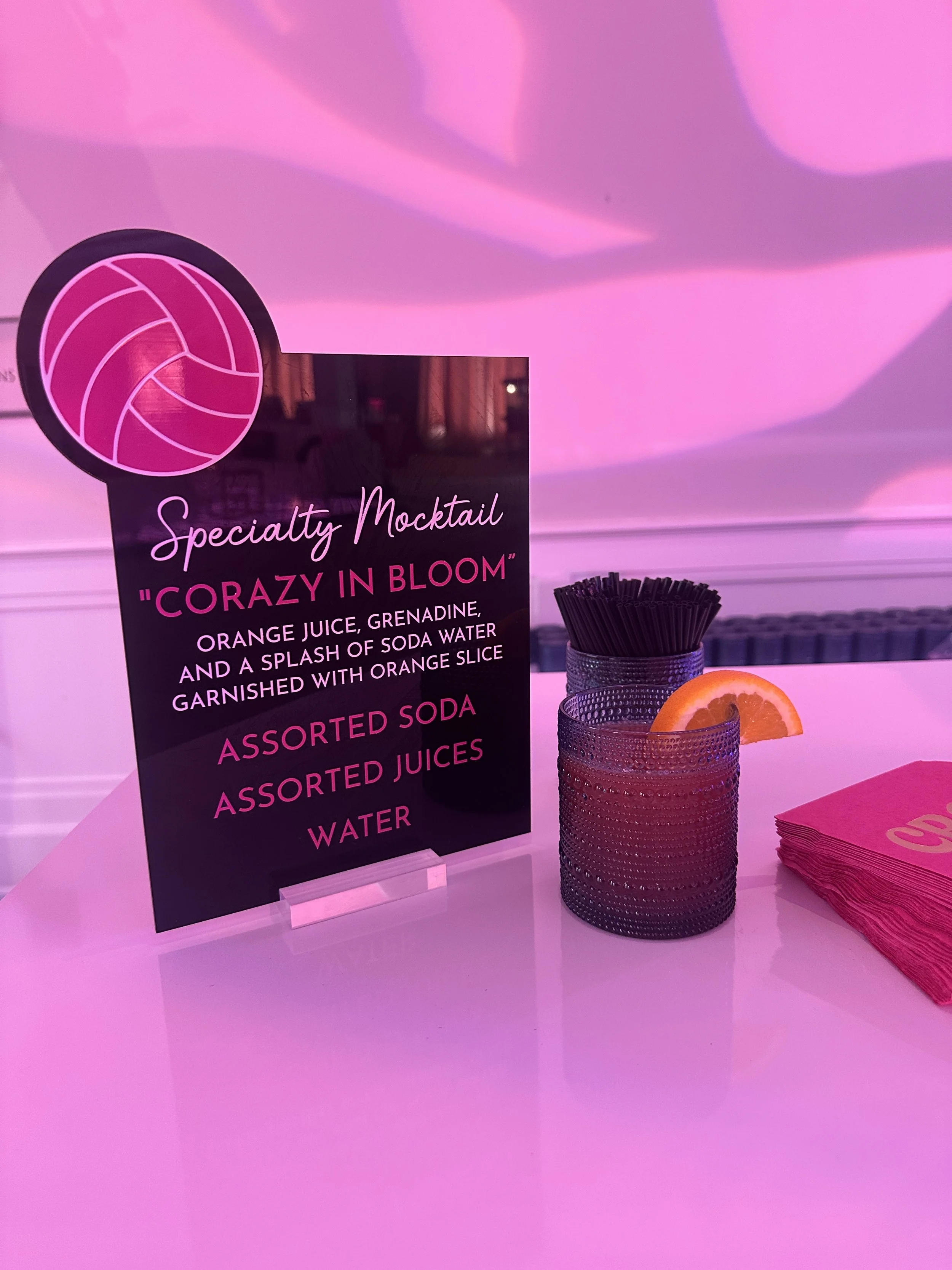 Custom volleyball themed drink menu in black and pink. 
