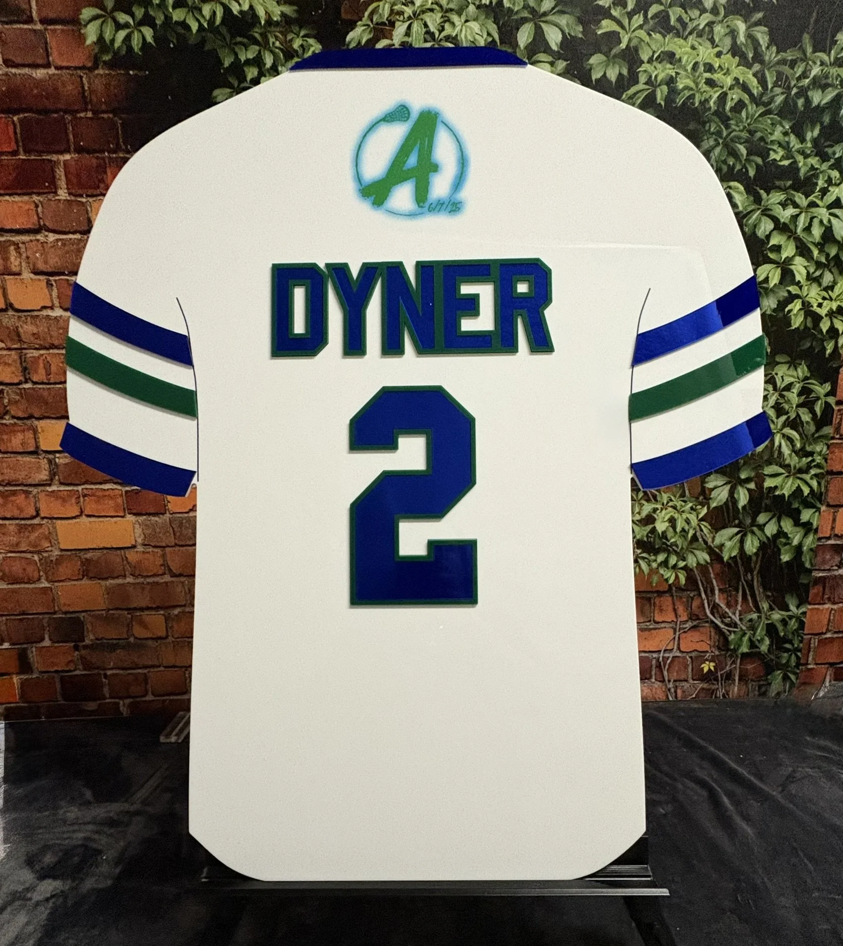 Custom white football jersey sign-in board with red and green mirror accents.