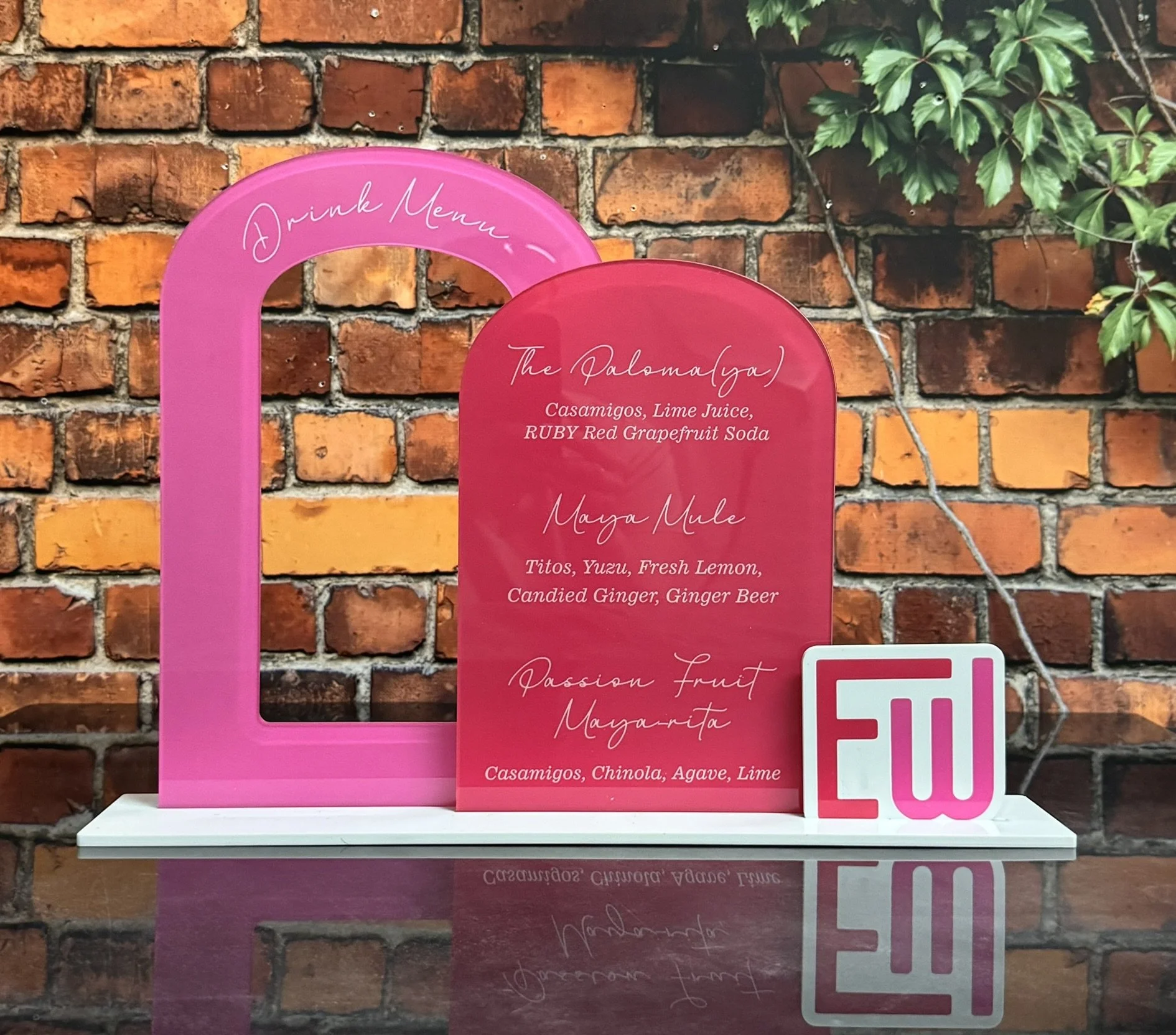 Custom double pink acrylic drink menu. 