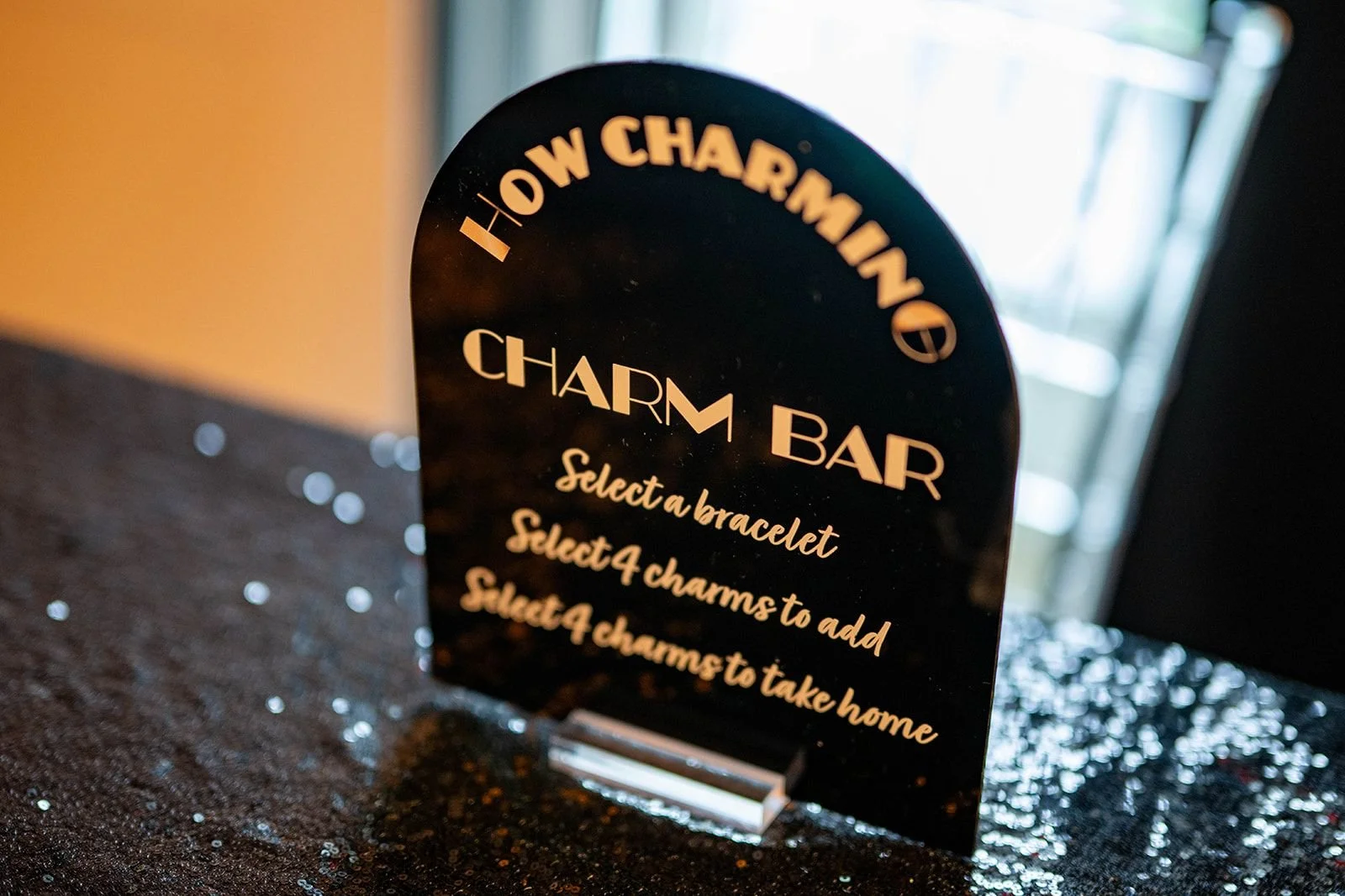 Custom black and gold charm bar menu. 