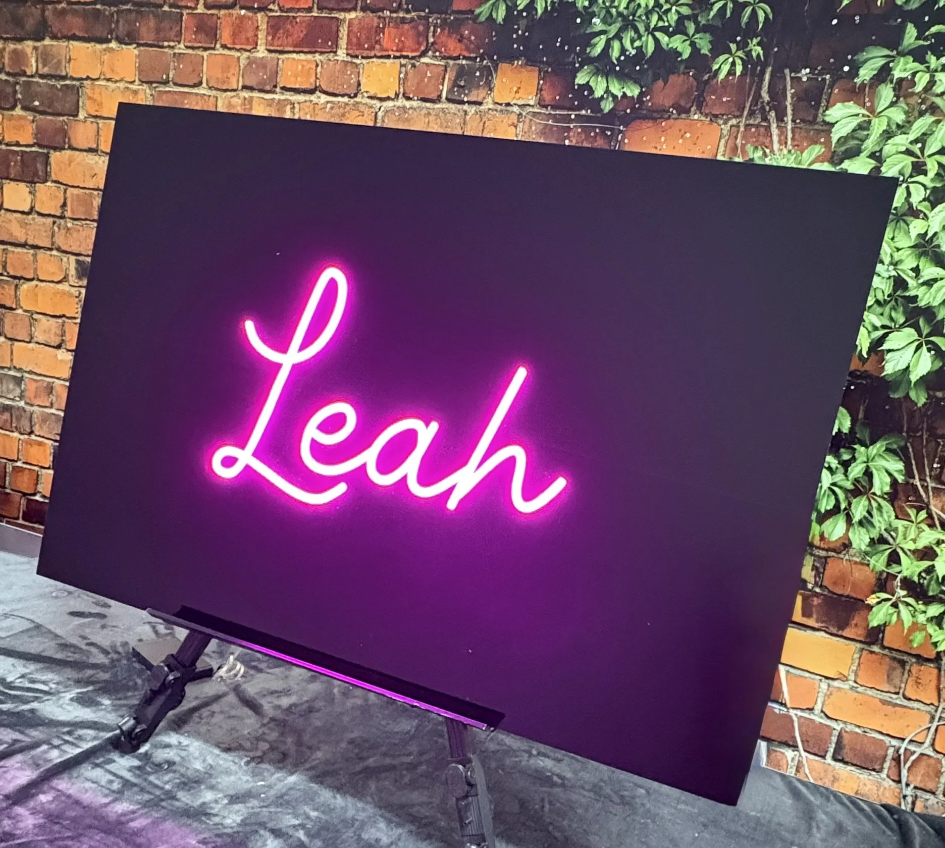 Black acrylic sign in board_pink_neon_script_bat.JPEG