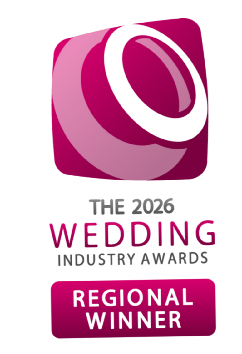 The image shows a pink 3D award trophy with a circular ring on top. Below it is text that reads "THE 2026 WEDDING INDUSTRY AWARDS REGIONAL WINNER."