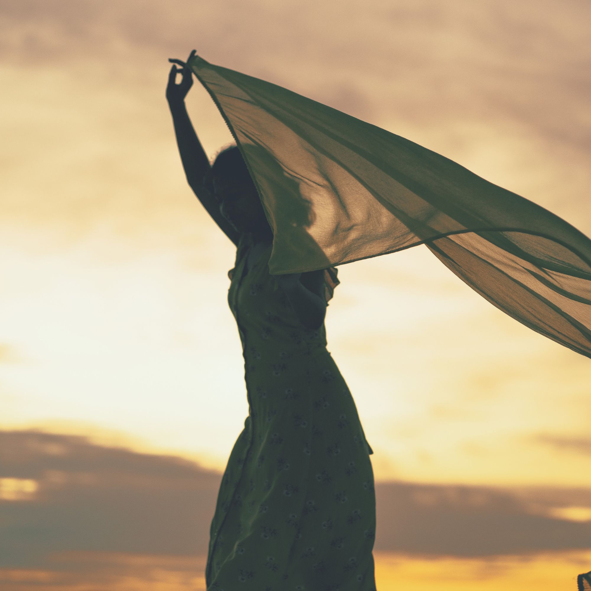 Woman peacefully moving her scarf