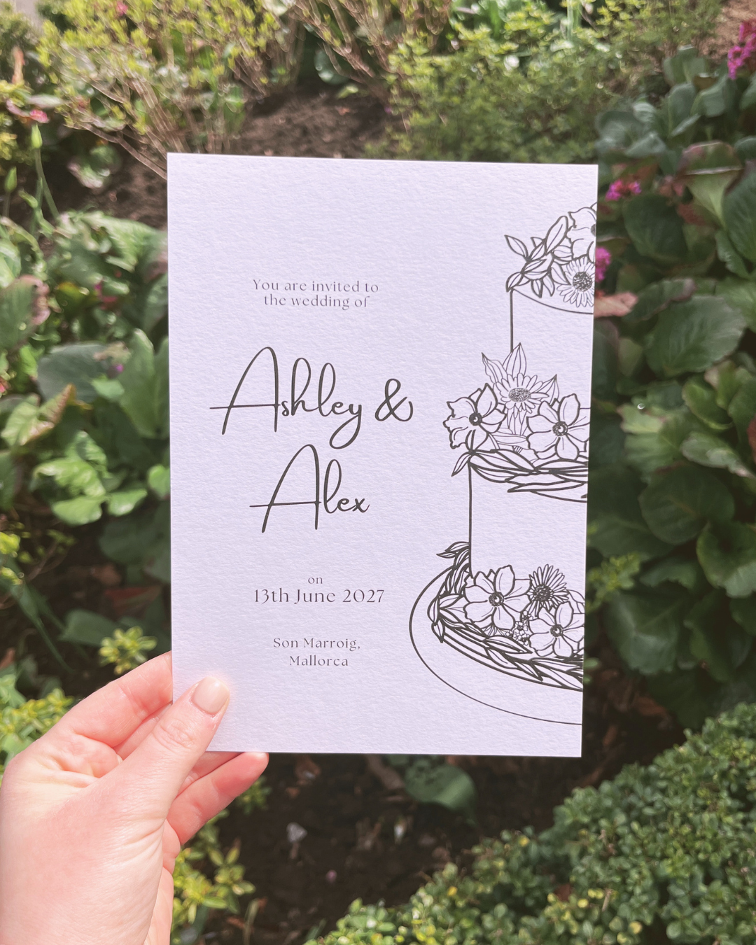 Invitation to a wedding for Ashley and Alex on June 13th, 2027, located in Son Marroig, Mallorca, featuring a floral illustration.