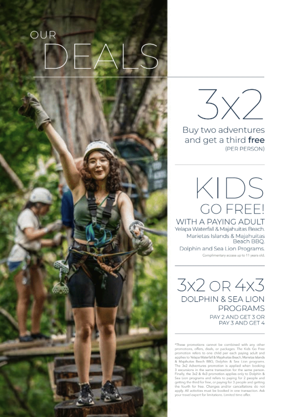 A group of people enjoying an outdoor adventure in a lush green forest, with a woman in the foreground smiling and holding a climbing harness.