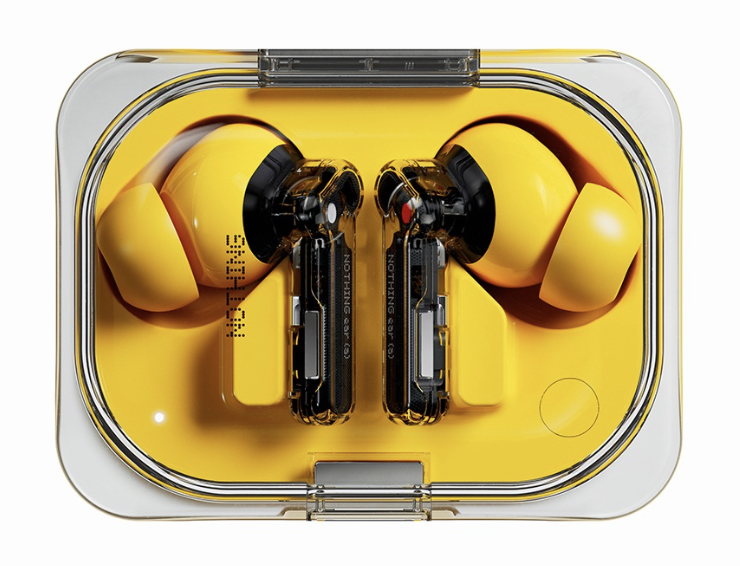 Yellow wireless earbuds in a clear charging case