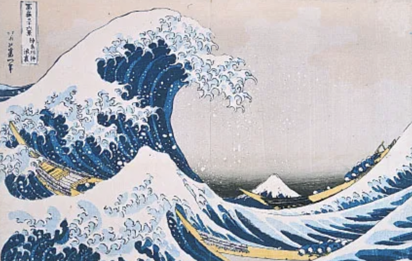 Japanese art of a large wave with boats, Mount Fuji in the background, by Hokusai.