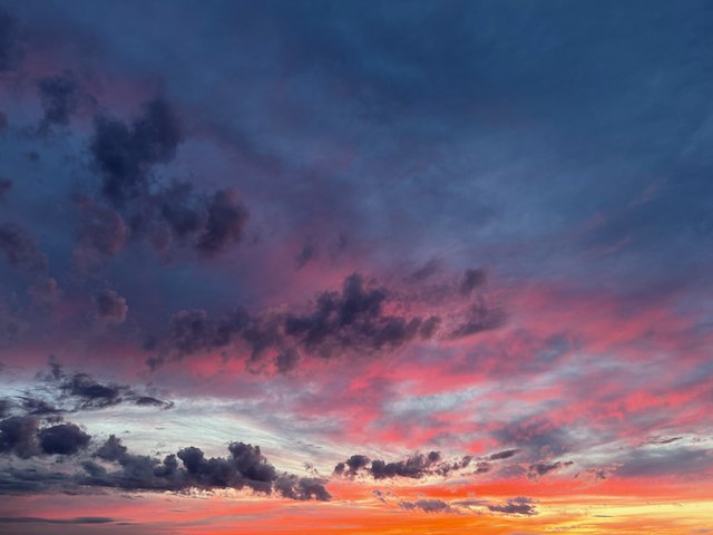Colorful sunset sky with pink, purple, and orange clouds