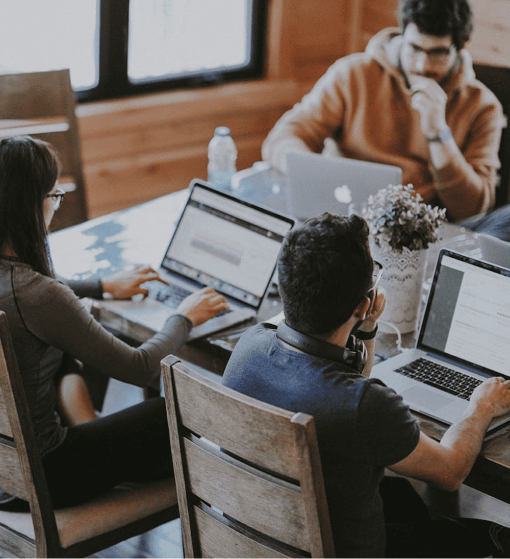 Remote workers at a shared desk