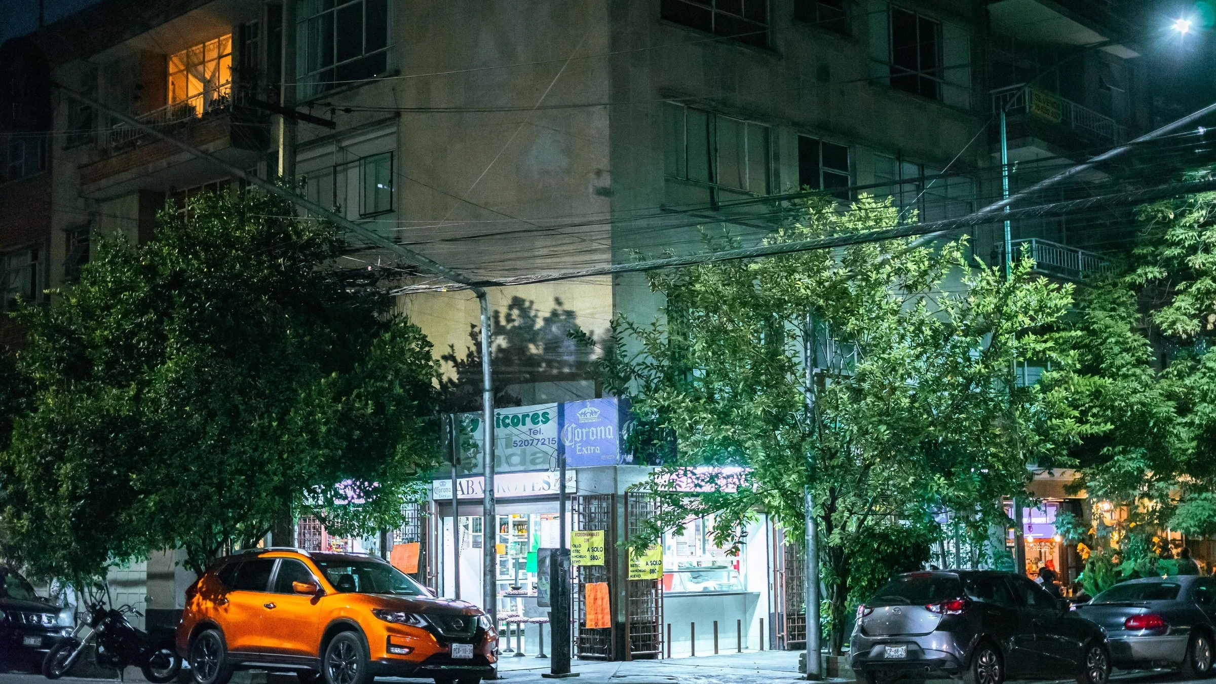 Night abarrotes shopfront and pavement, Mexico City