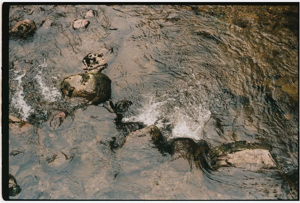 Rocks in a shallow flowing creek.