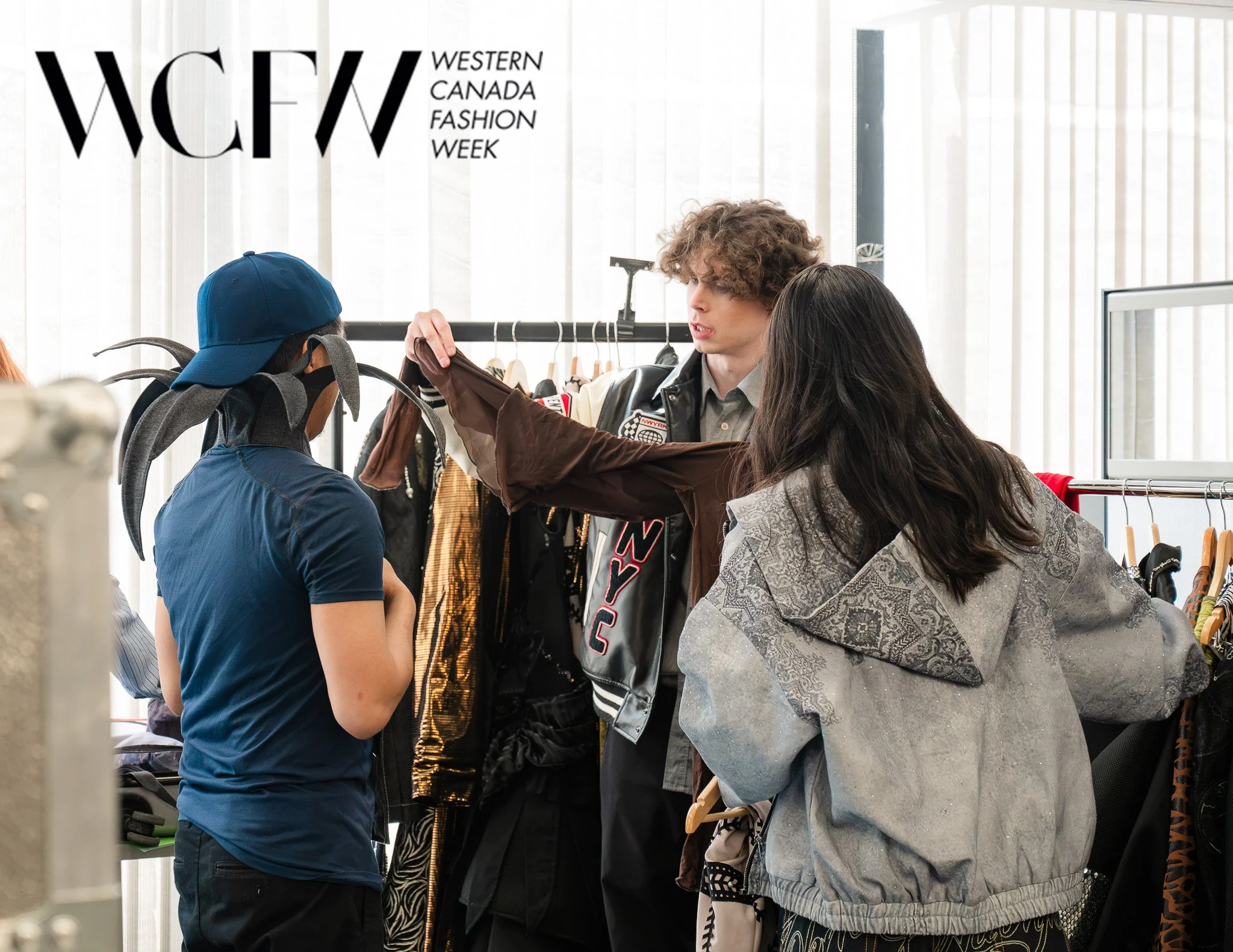 People shopping at a clothing store during Western Canada Fashion Week.