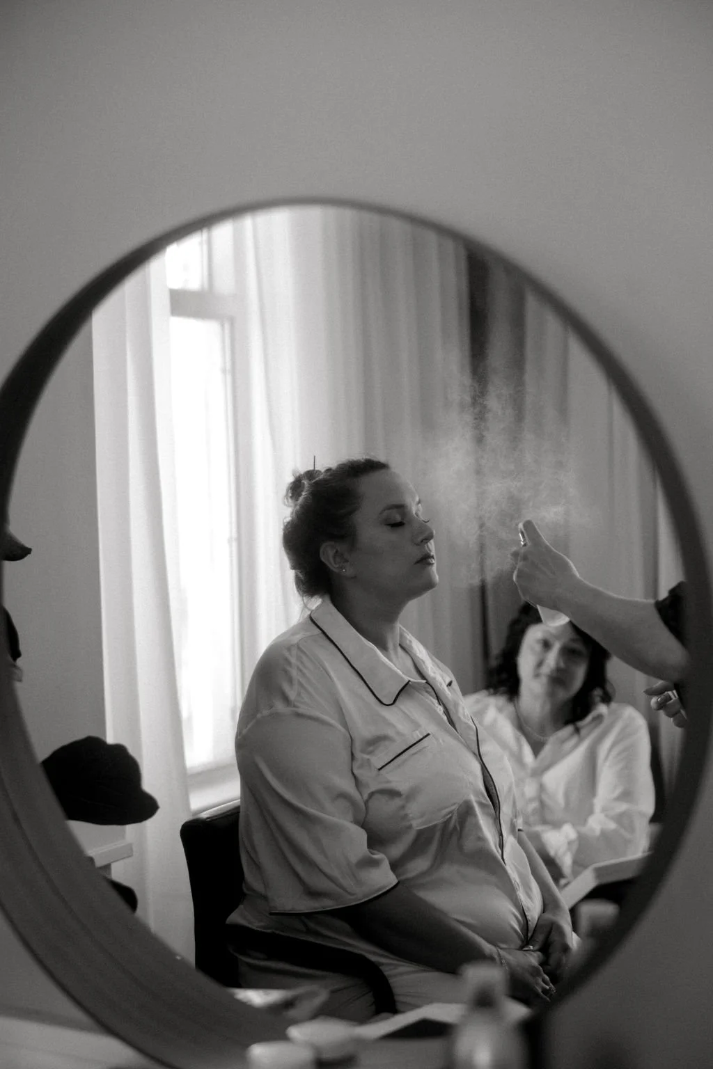 Amanda Hopcraft doing makeup for the bridal party.