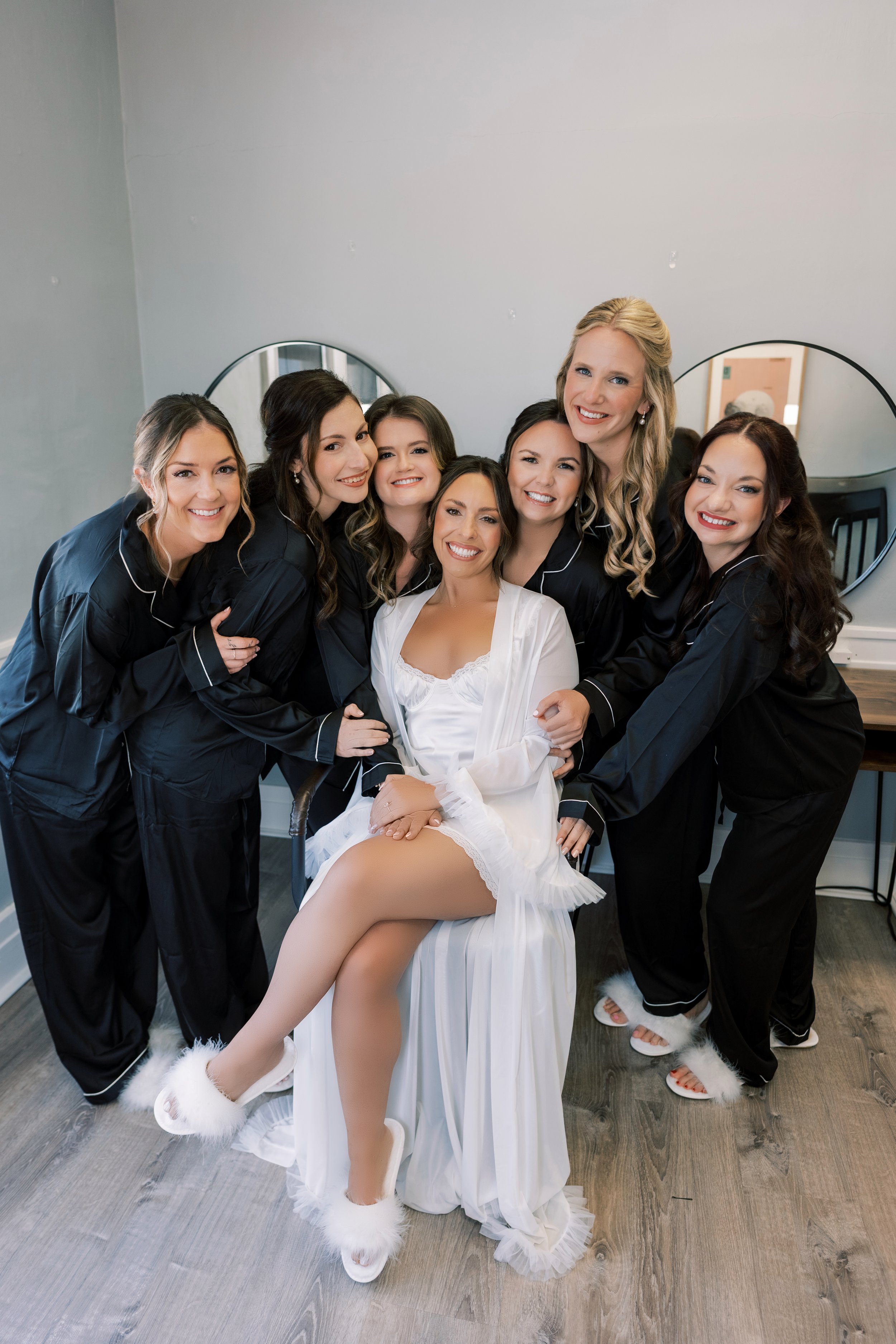 Bride and Bridal party pose after getting all glammed up for the big day!
