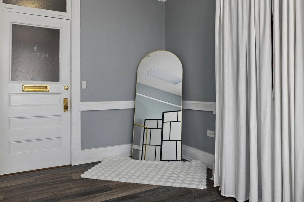 Private dressing area with full length mirror. 