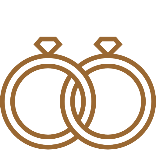Two brown wedding rings with a black background.