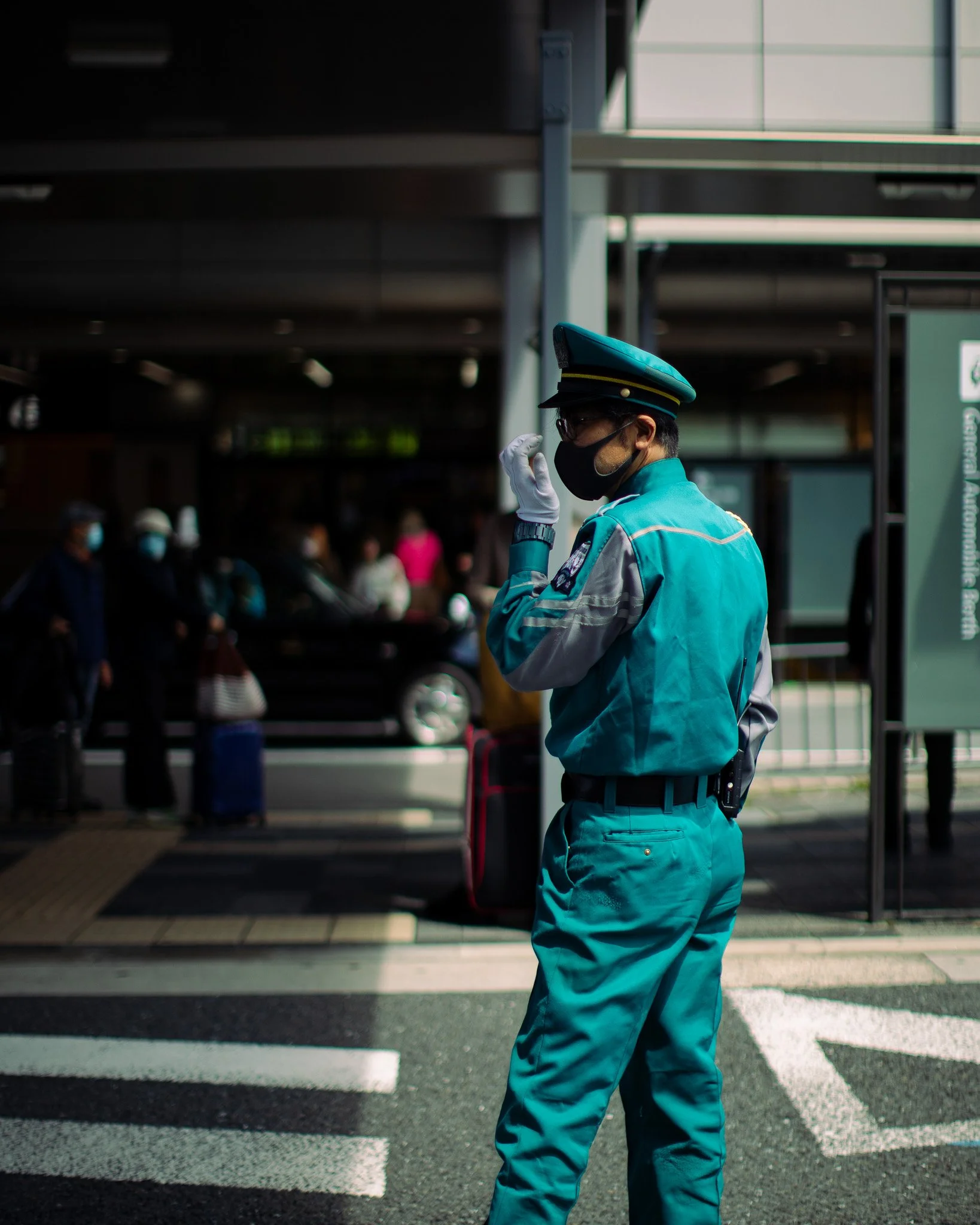 kushphoto-japan-teal-uniform-guard-crosswalk-2024.jpg