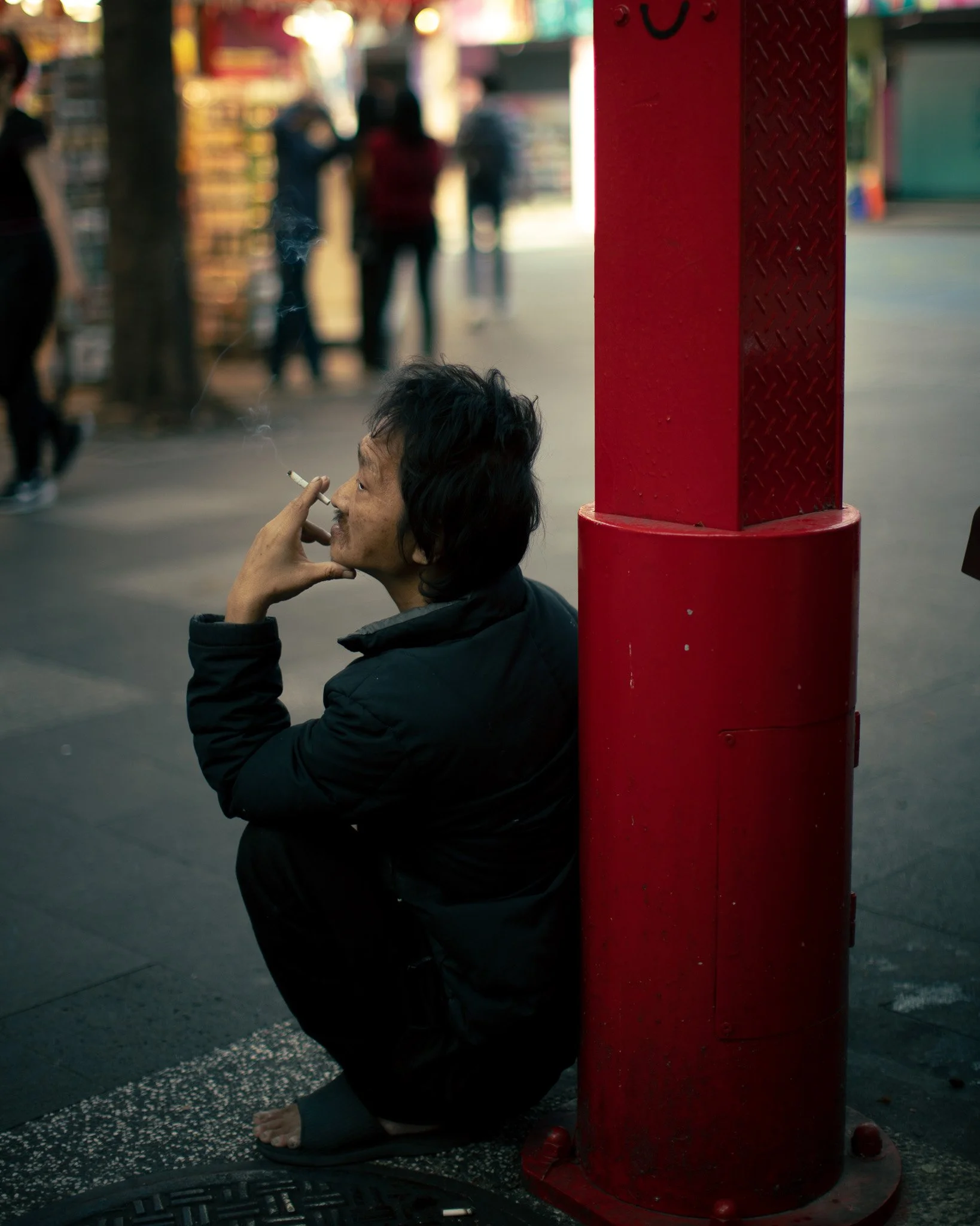 kushphoto-taiwan-man-smoking-red-pillar-street-2025.jpg