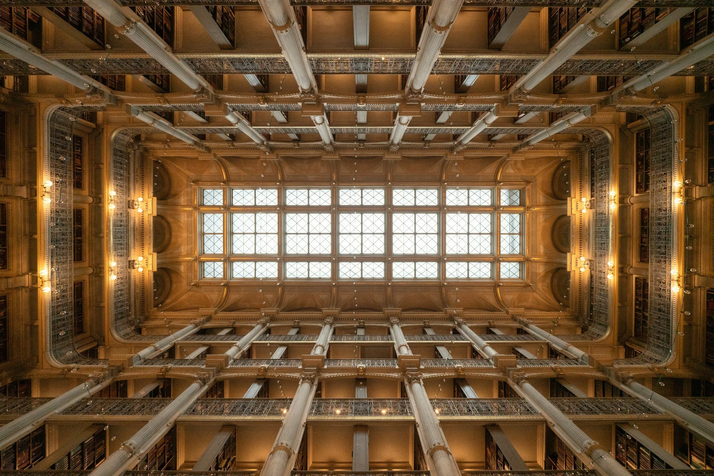 A ceiling shot of the Peabody Library in Baltimore that shows the sky is the limit with libraries.