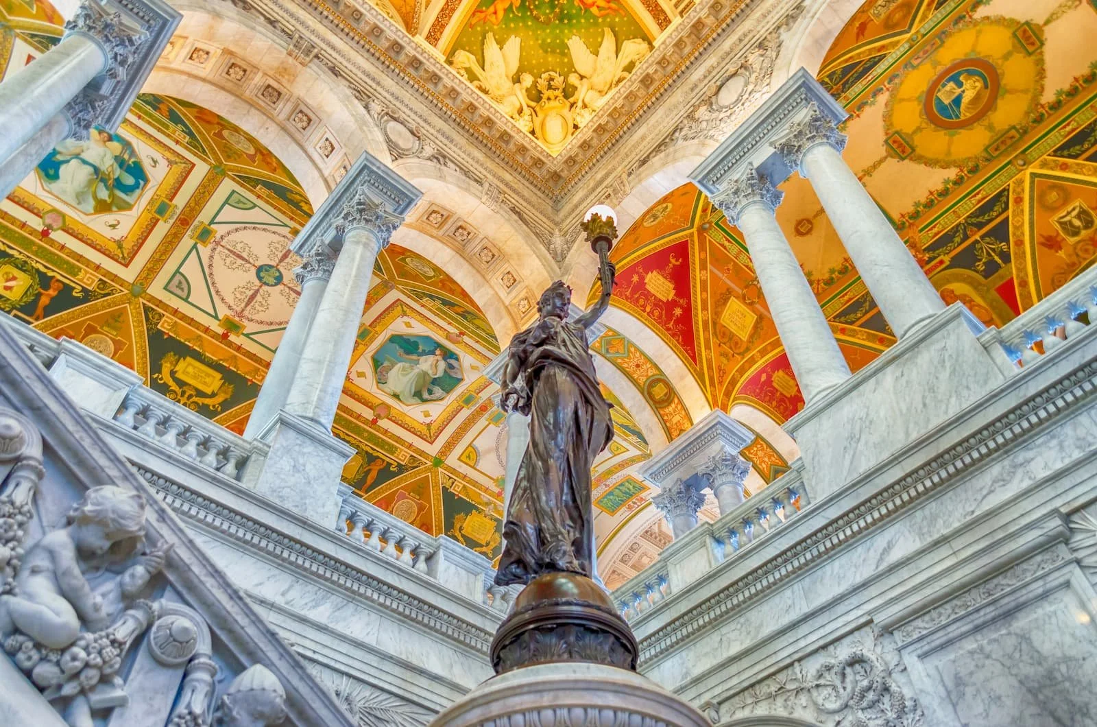 A cover photo for our hero page for Trove Bookstore that shows a beautiful rendering of the Library of Congress's forum with a statue of a woman holding a lamp as if Lady Liberty.