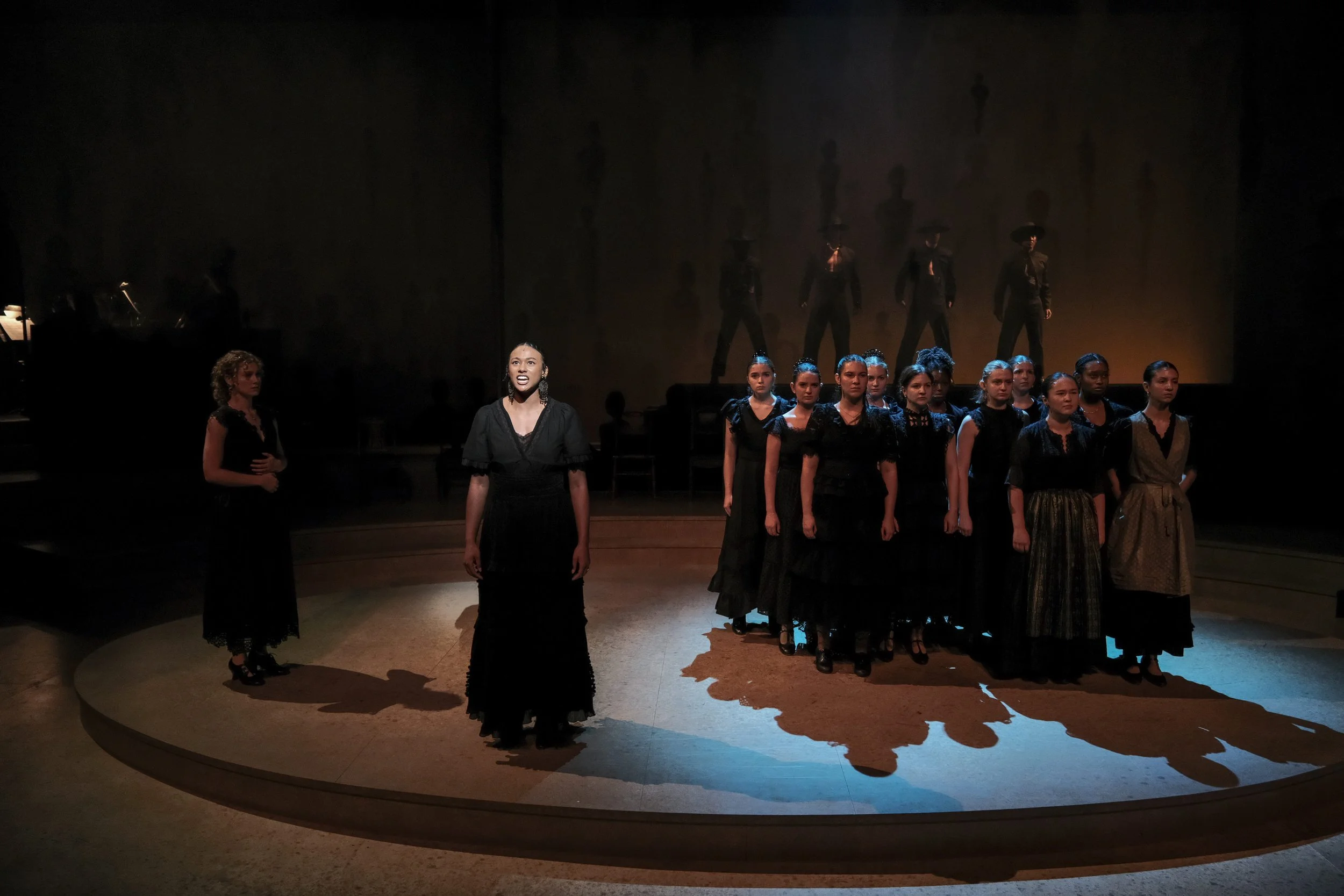 Direction and choreography by William Carlos Angulo; Scenic design by Zeke Leonard; Costume design by Carmen M. Martínez; Lighting design by Henry Killbourn