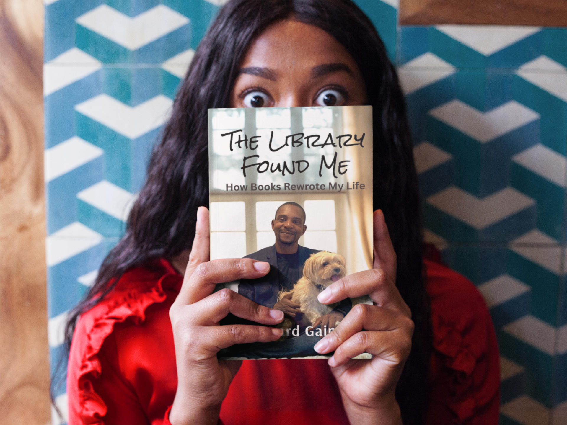 surprised-woman-holding-a-book-mockup-while-against-a-tiles-wall-a17345.png