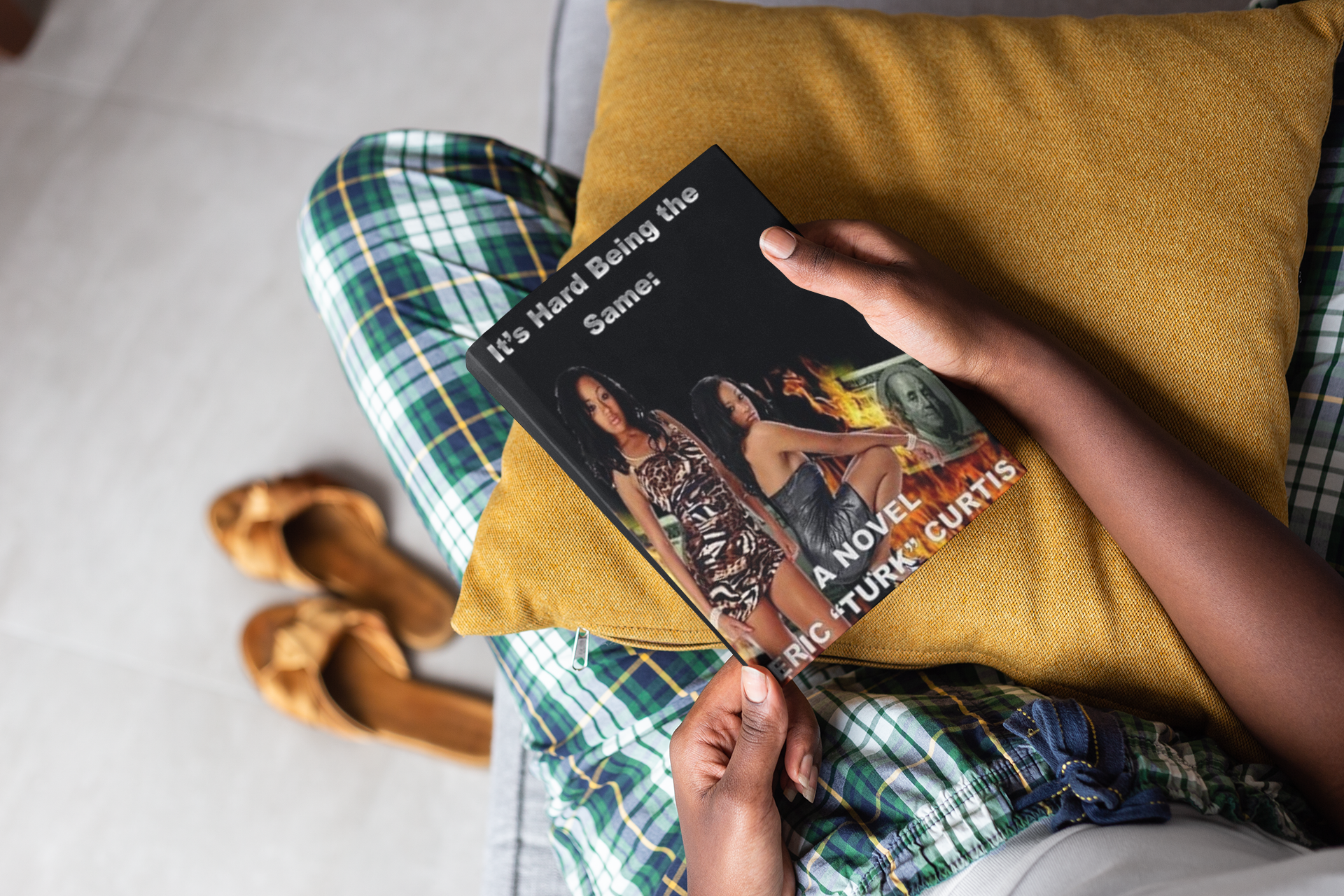 mockup-of-a-book-held-by-a-woman-s-hands-on-a-couch-23695.png