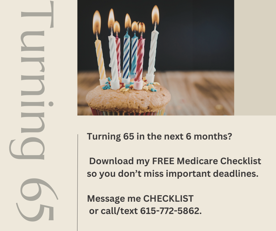 A cupcake with lit birthday candles on top, decorated with colorful sprinkles.