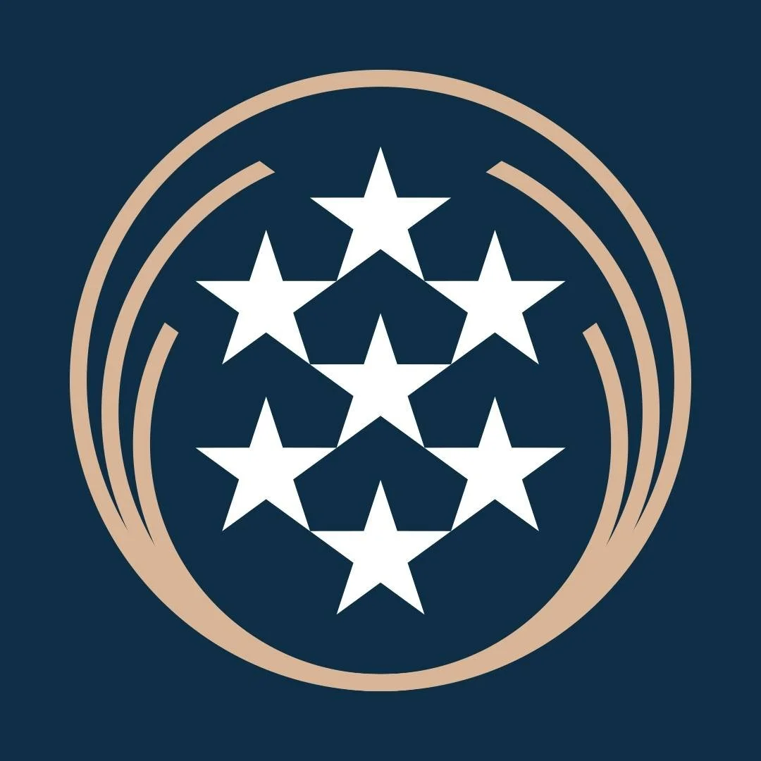 A logo featuring seven white stars arranged in a pyramid shape inside a circular beige outline against a dark blue background.