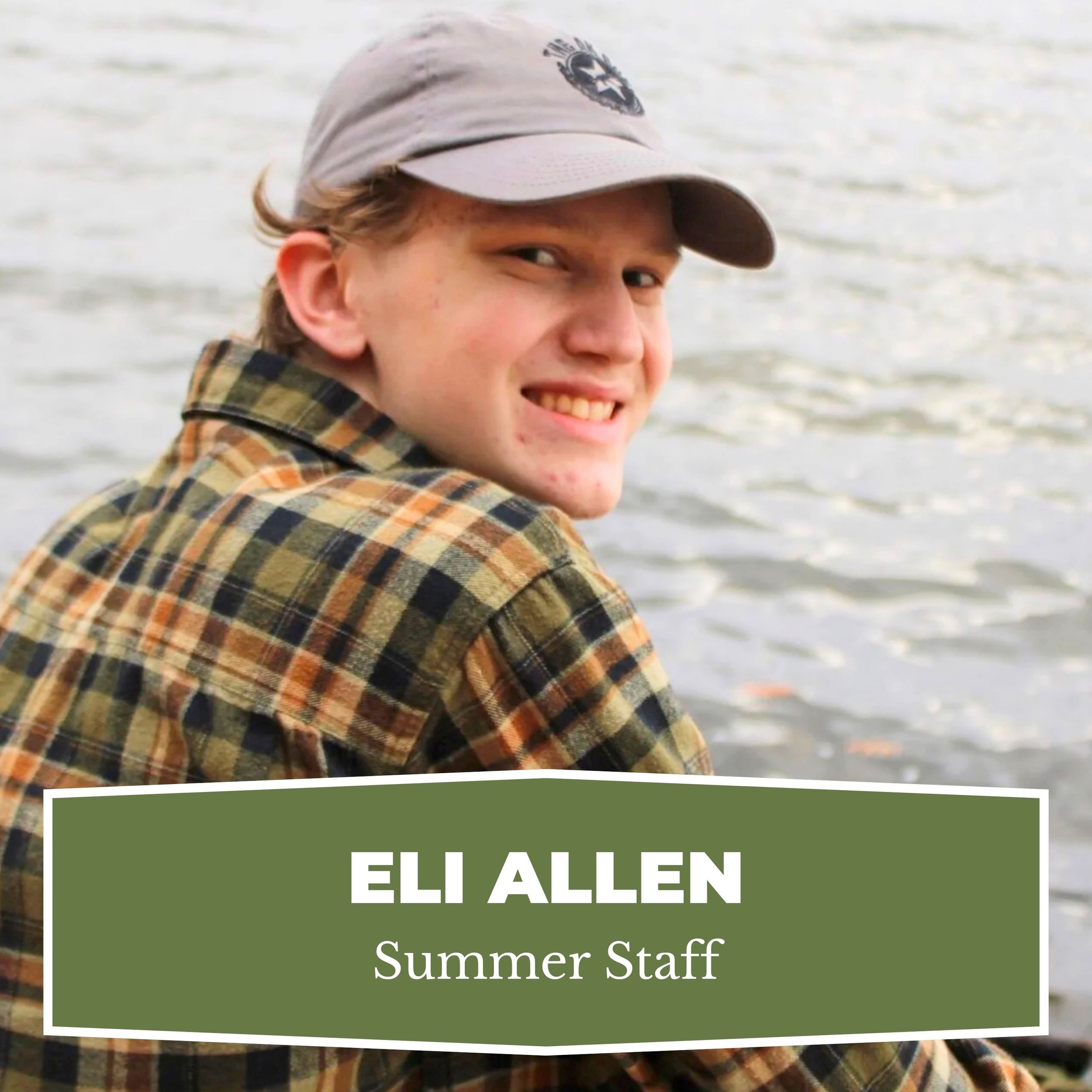 A young man with a gray cap and a checkered shirt sitting by a lake, smiling at the camera, with a green label that reads 'Eli Allen, Summer Staff'.