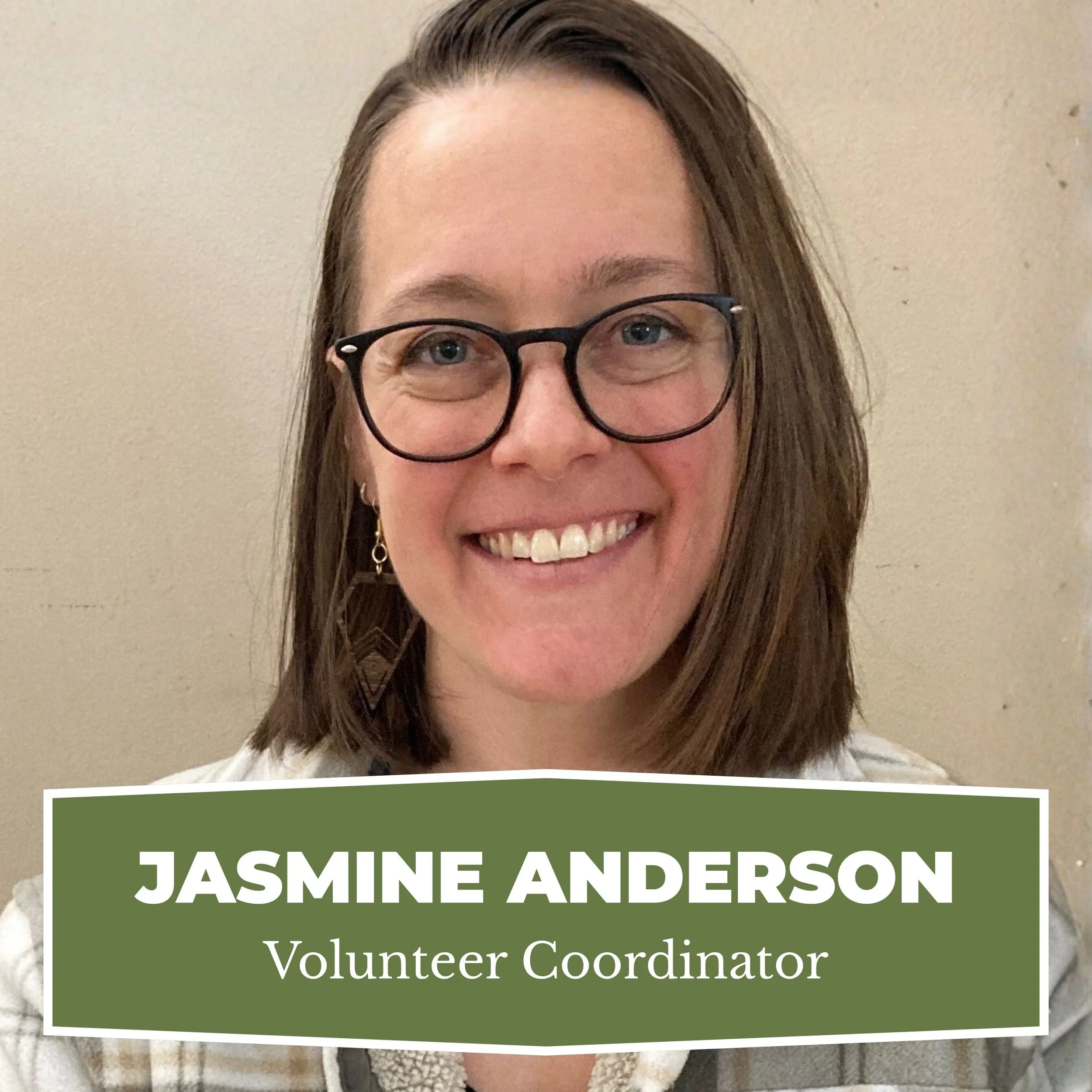 Portrait of a woman with shoulder-length brown hair, glasses, and earrings, smiling in front of a beige wall. Overlay text reads 'Jasmine Anderson, Volunteer Coordinator'.