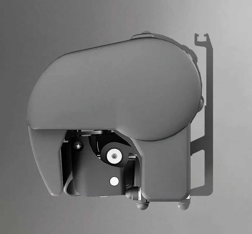 Close-up side view of a gray robotic helmet or head-mounted device with exposed mechanical components and rear mounting bracket