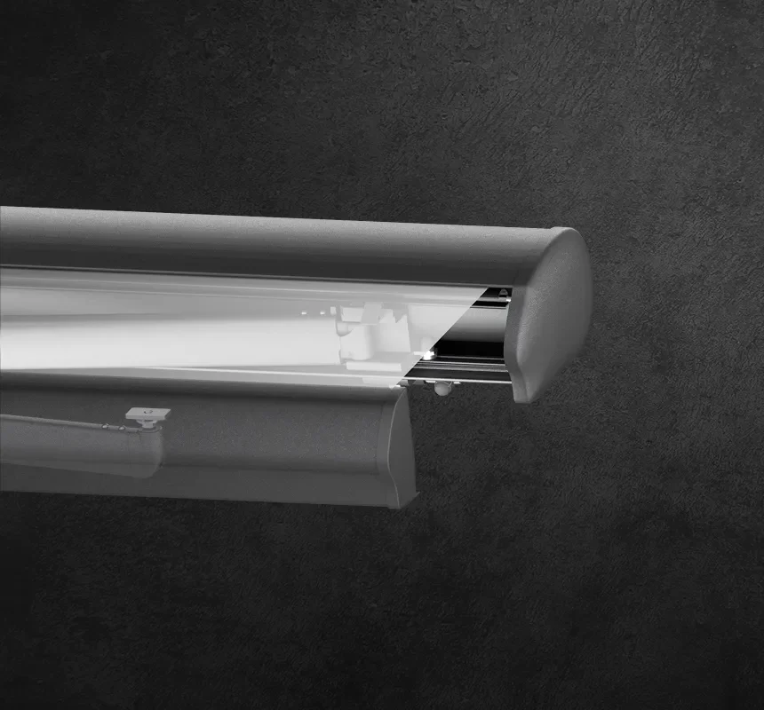 Close-up of a roller shade housing with the fabric partially removed to reveal its internal components