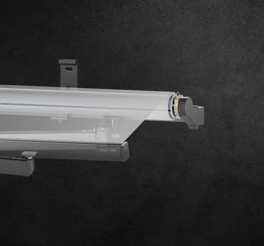 Close-up of a wall-mounted roller shade with a translucent fabric panel, bottom rail, and side mounting bracket against a dark textured wall.