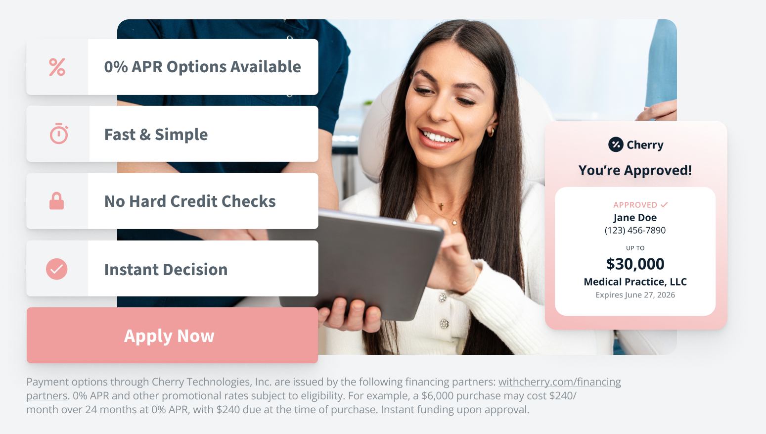 A woman smiling while holding a tablet in front of an advertisement for Cherry Technologies loans, showing approval for a loan of up to $30,000 with no hard credit checks, instant decision, and 0% APR options.