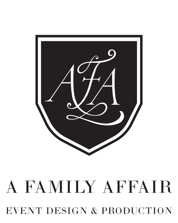 Logo for A Family Affair, an event design and production company, featuring a shield with intertwined initials 'AFA' in elegant cursive, with the company name and tagline below.