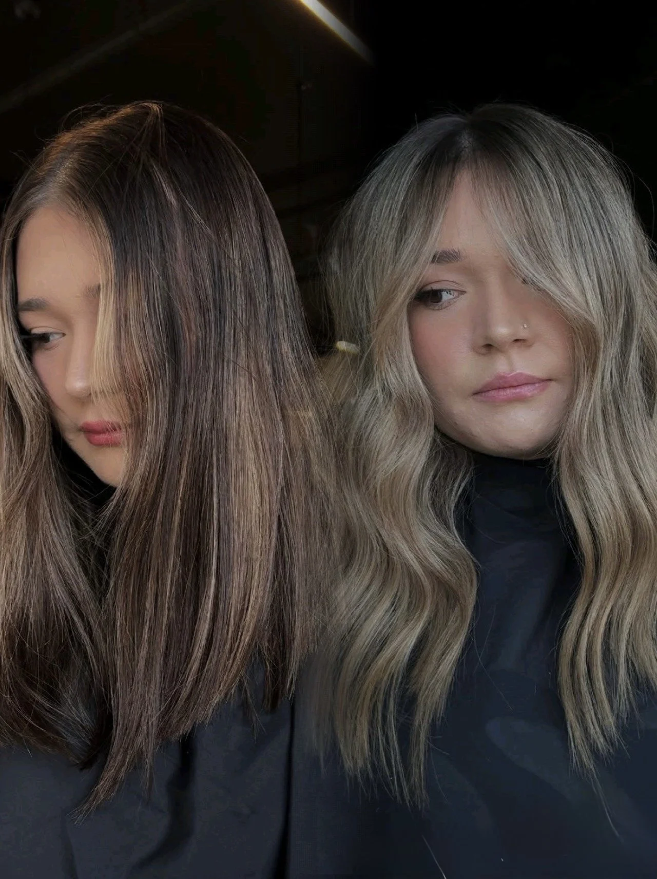 Two women with long, wavy hair and light skin, one with platinum blonde hair and the other with brown hair, looking away from the camera.