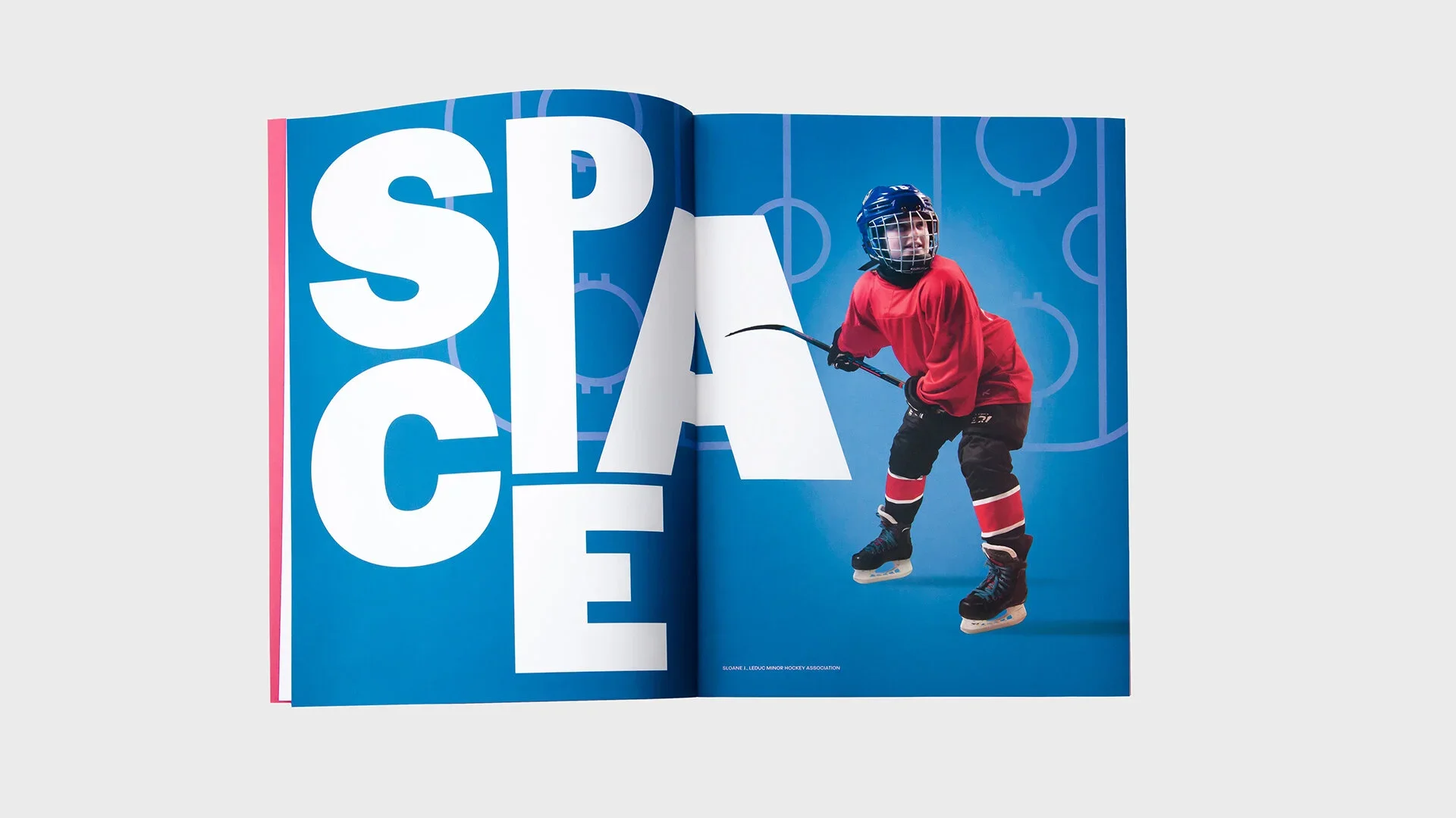 Magazine spread featuring a young hockey player in red jersey and black pants with red and white stripes, holding a hockey stick, on a blue background with the word 'SPACE' in large white letters.