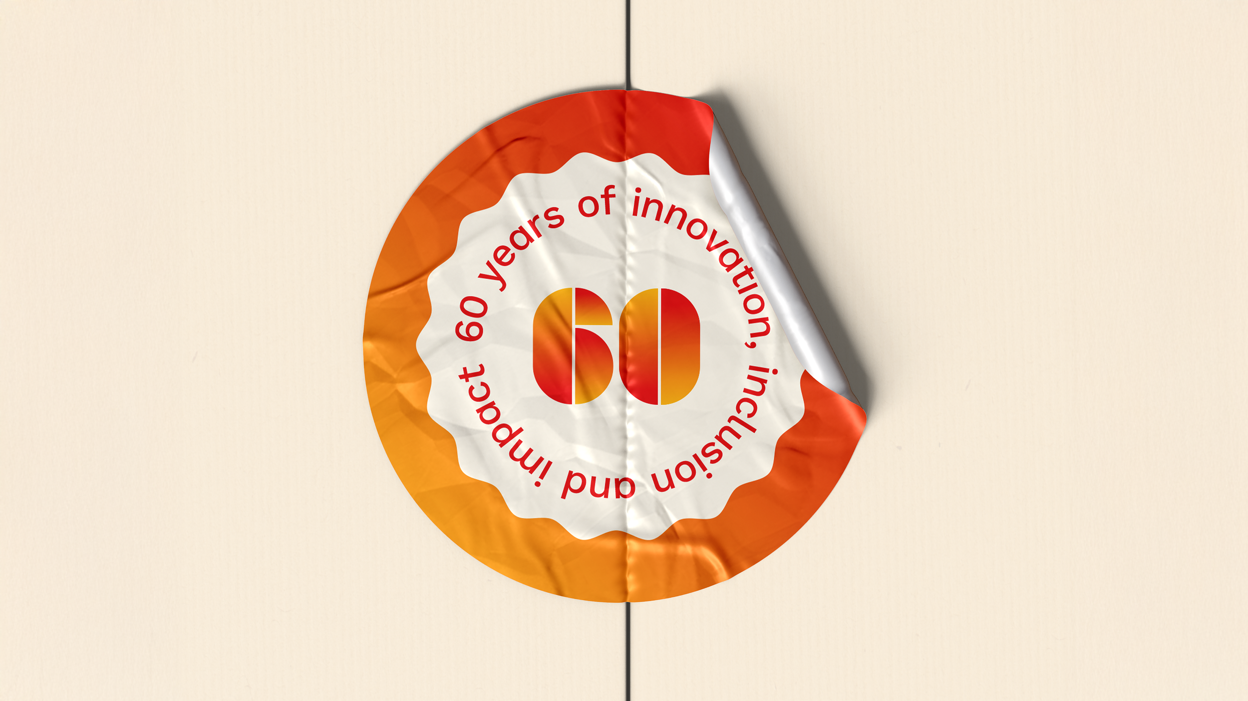 A circular sticker celebrating 60 years of innovation, with the number 60 in the center, surrounded by the text '60 years of innovation, and 60 impact' on a cream background.