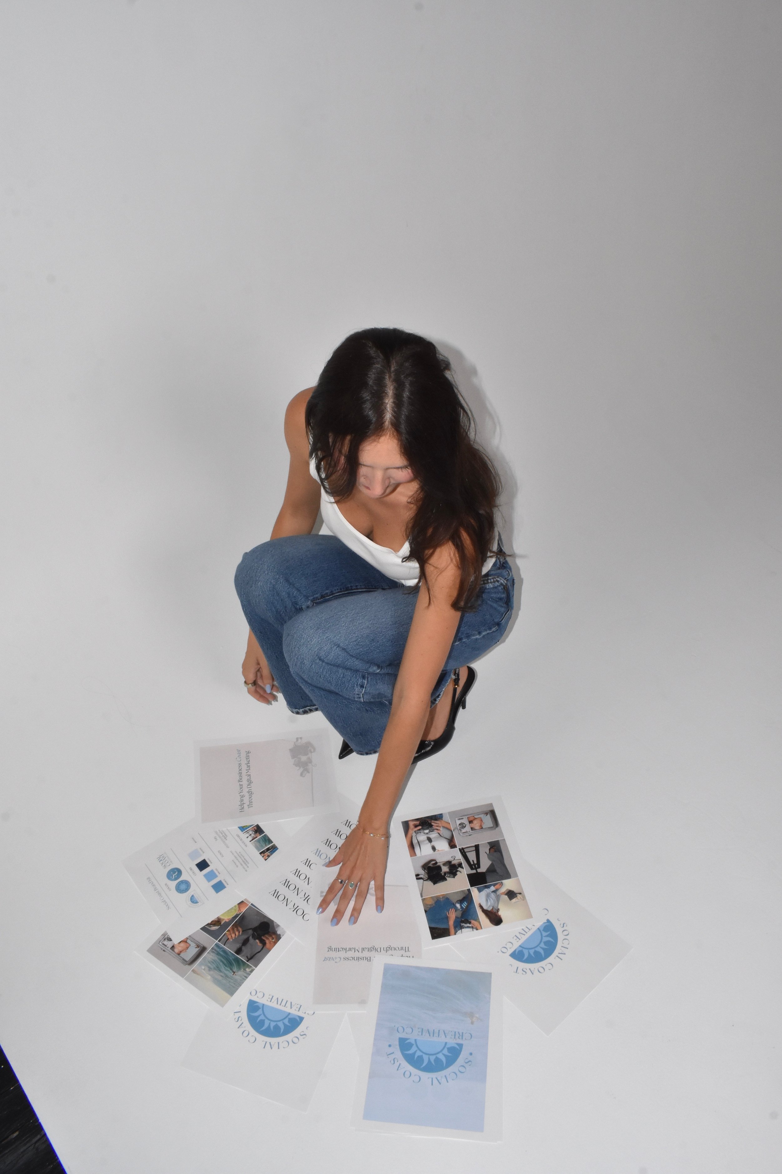 Celia reviewing Social Coast Creative Co. brand content and social media materials