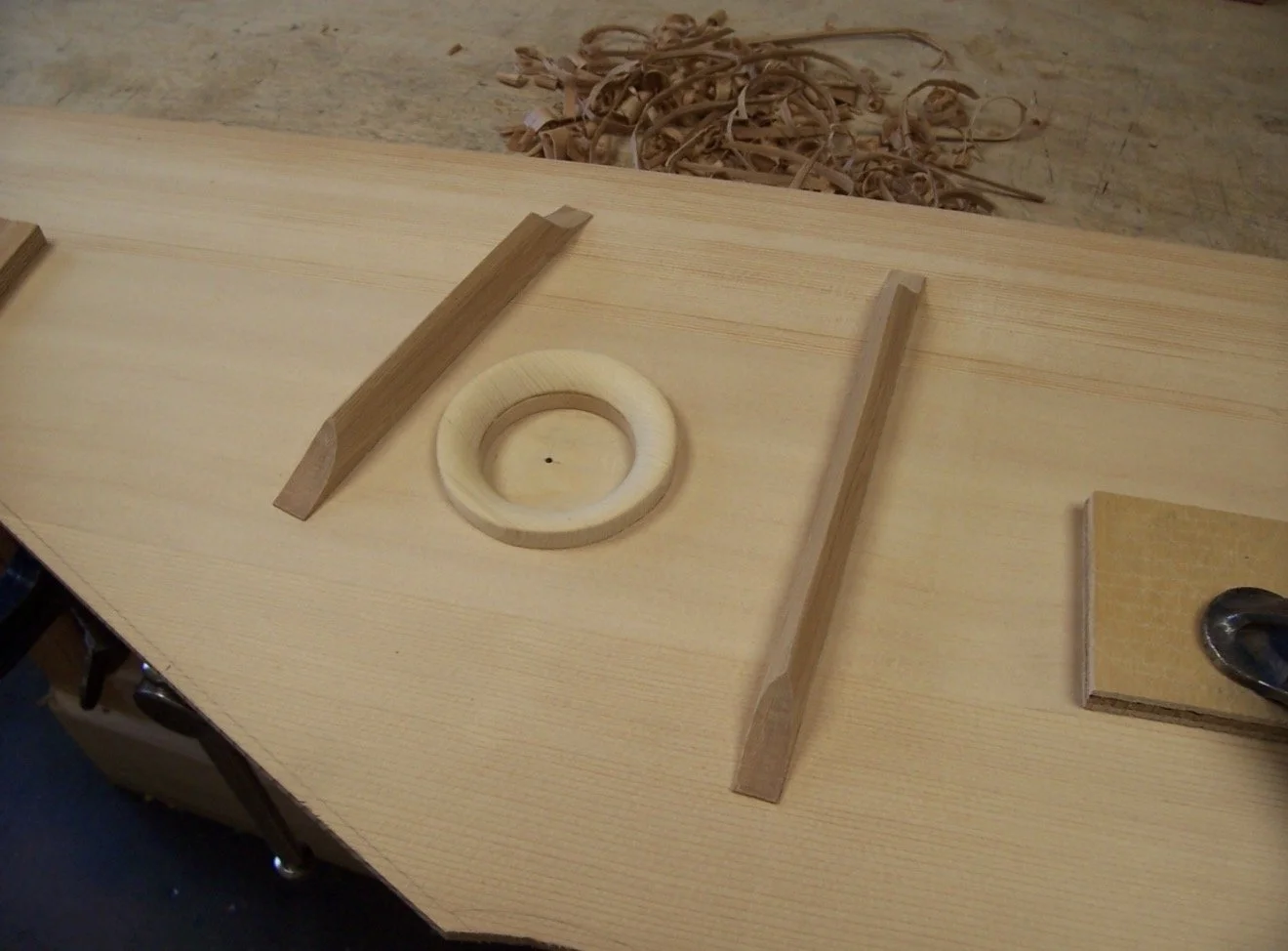 Internal sound-hole ring and voiced soundboard struts in place