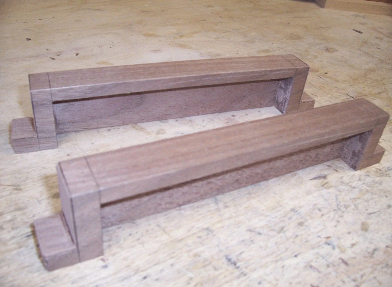 Roughly shaped Walnut chord-bar covers prior to final carving and polishing