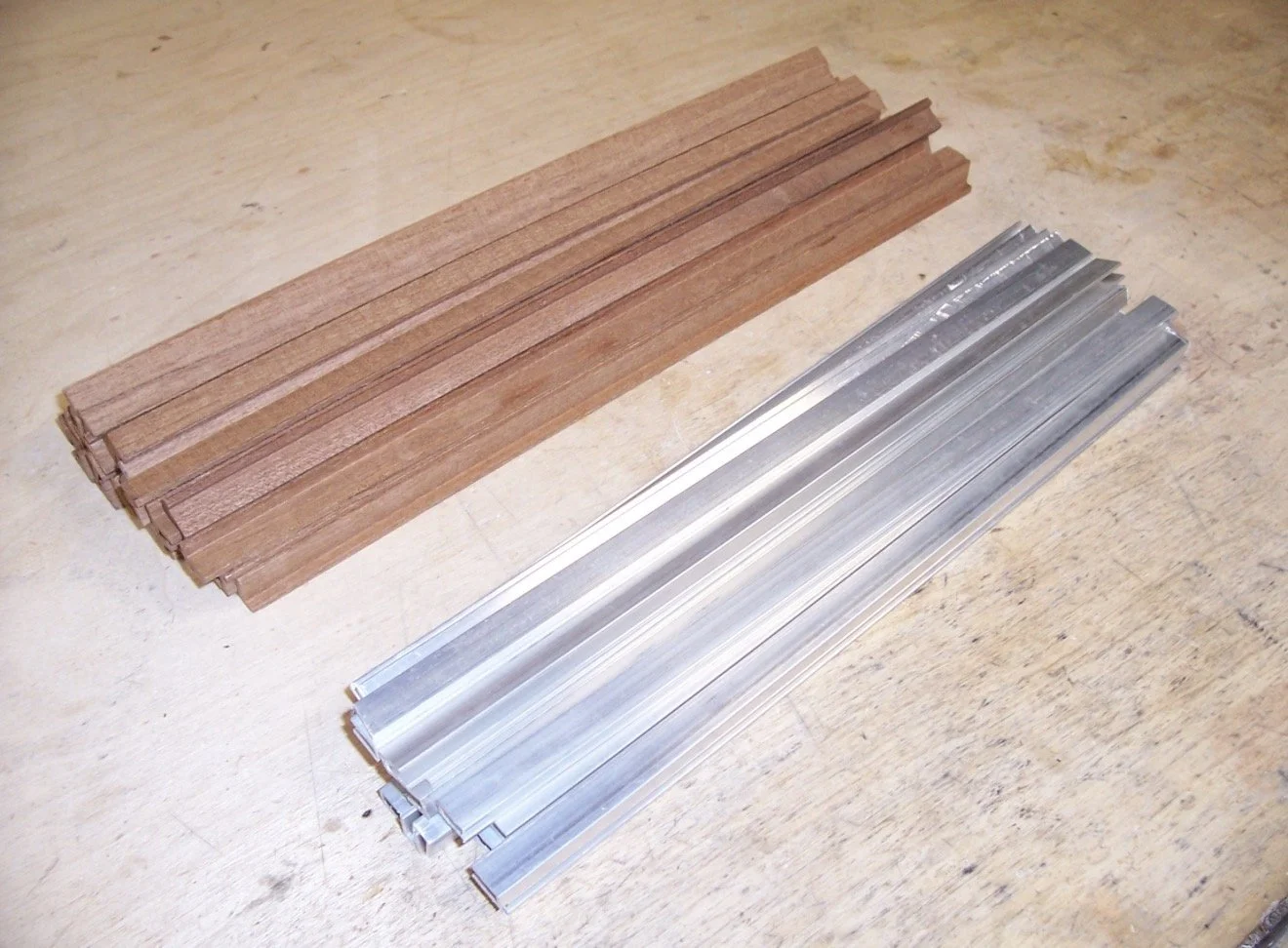 Chord-bar channel and Mahogany T section prepared ready for gluing together and milling a slot to one end and a drilled hole at the other