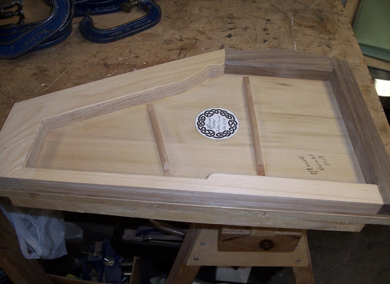 Back struts carved and makers label glued in place