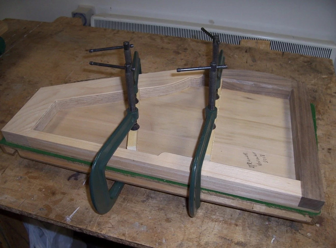 Complete harp frame and strut blanks glued in prior to final carving